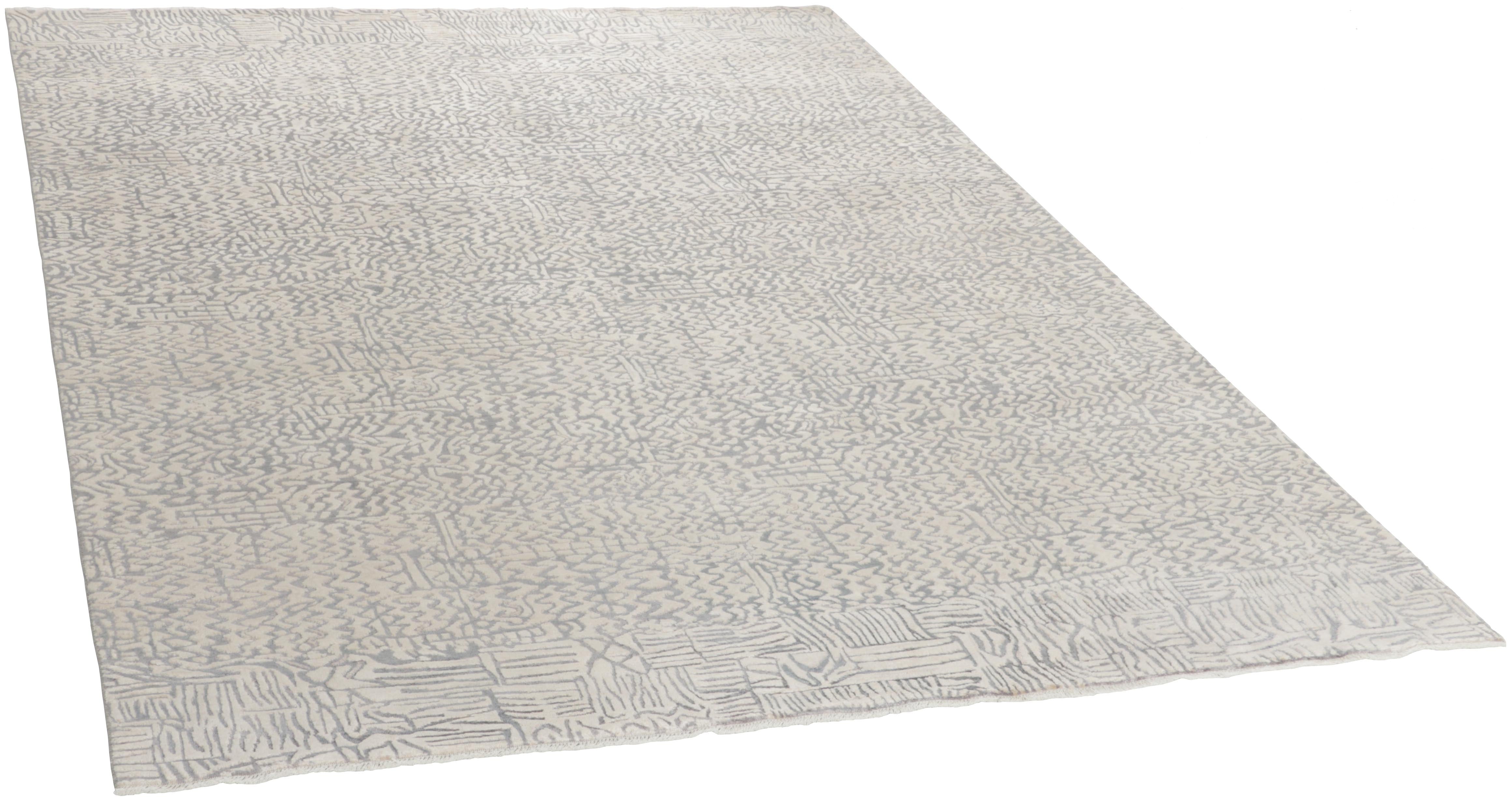 Authentic oriental rug with a damask pattern in beige