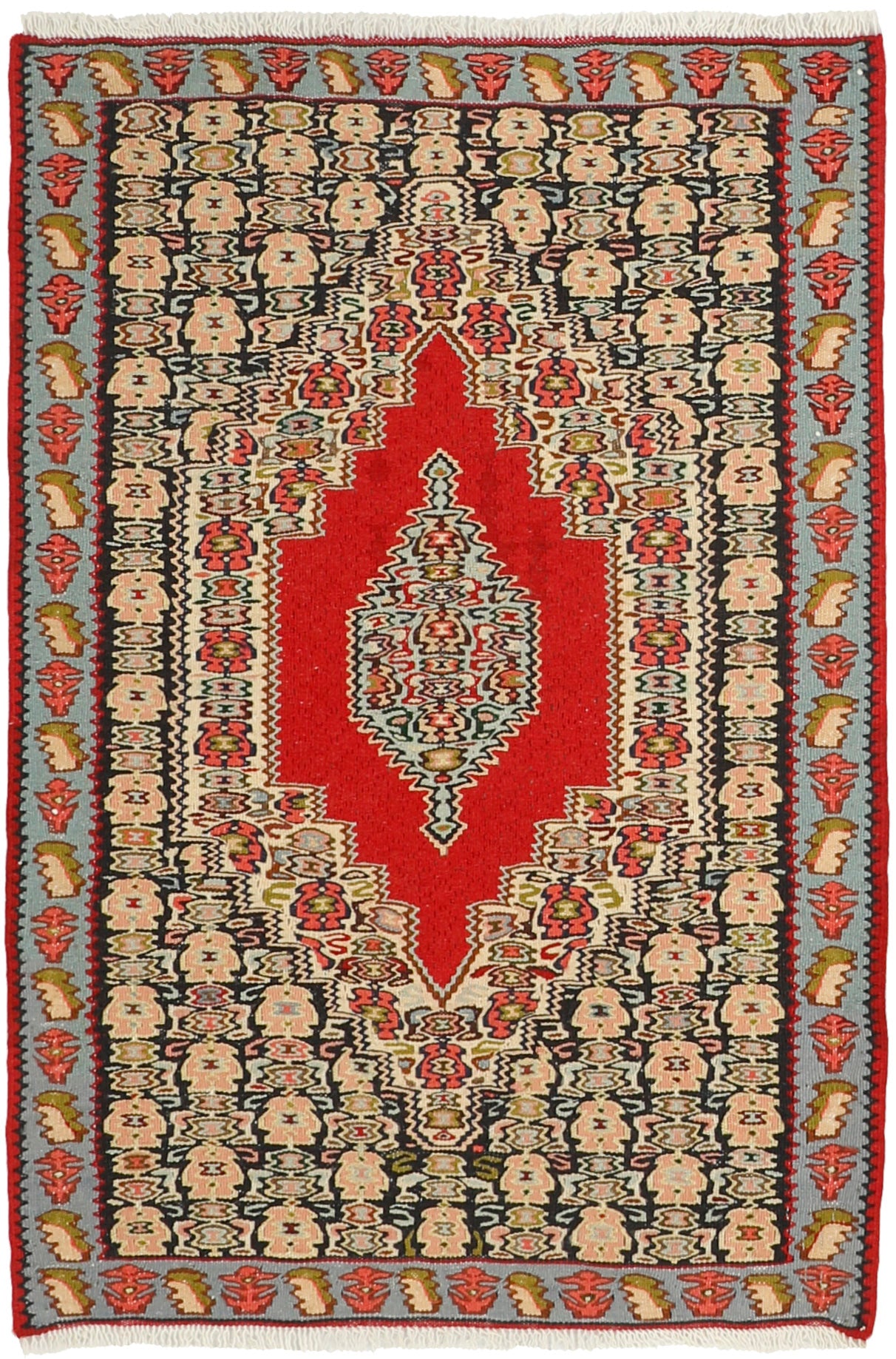 Rectangular natural beige rug with terracotta red, grey and black aztec design and black tassel border
