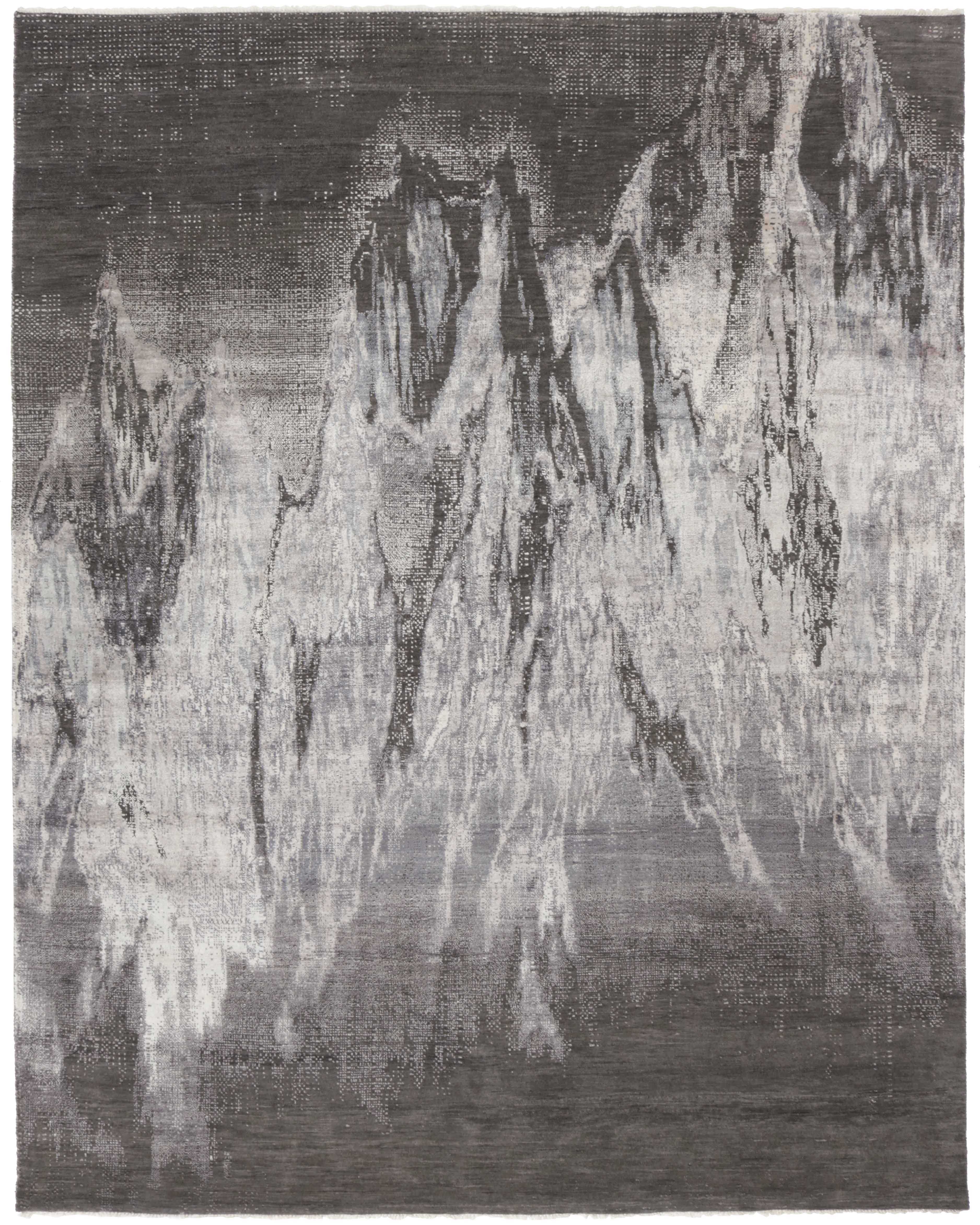 Large area rug with abstract design in grey and charcoal