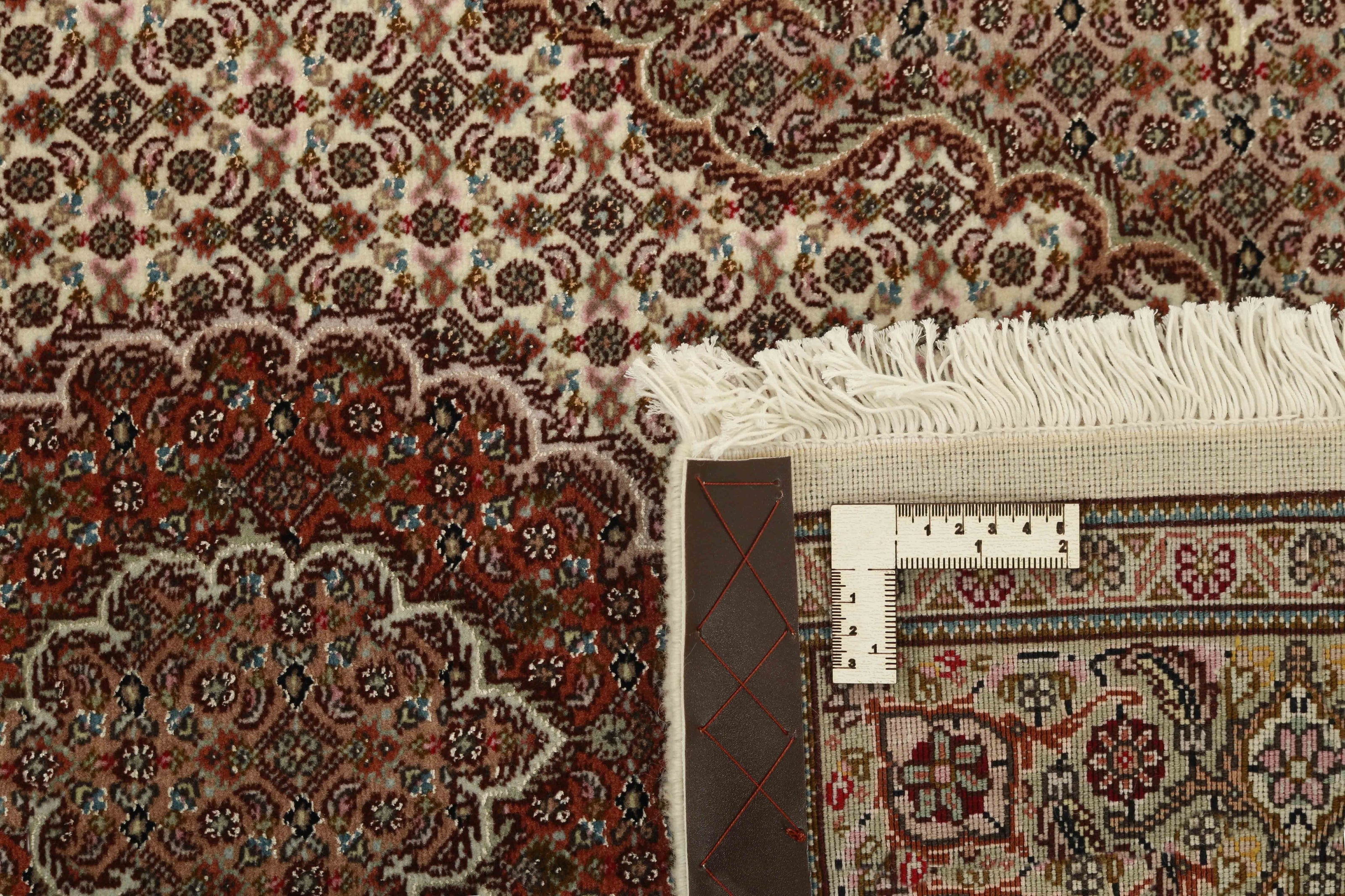 Authentic persian runner with traditional floral design in red