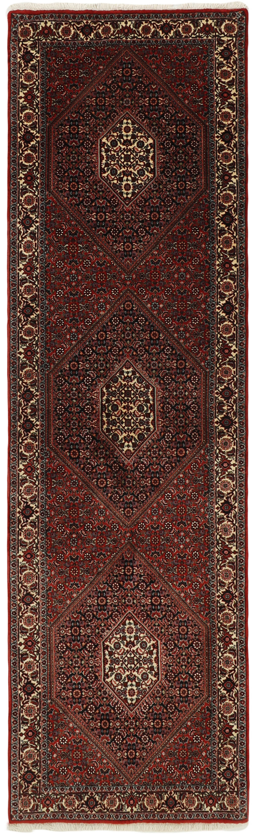 Red and cream persian runner with traditional floral design