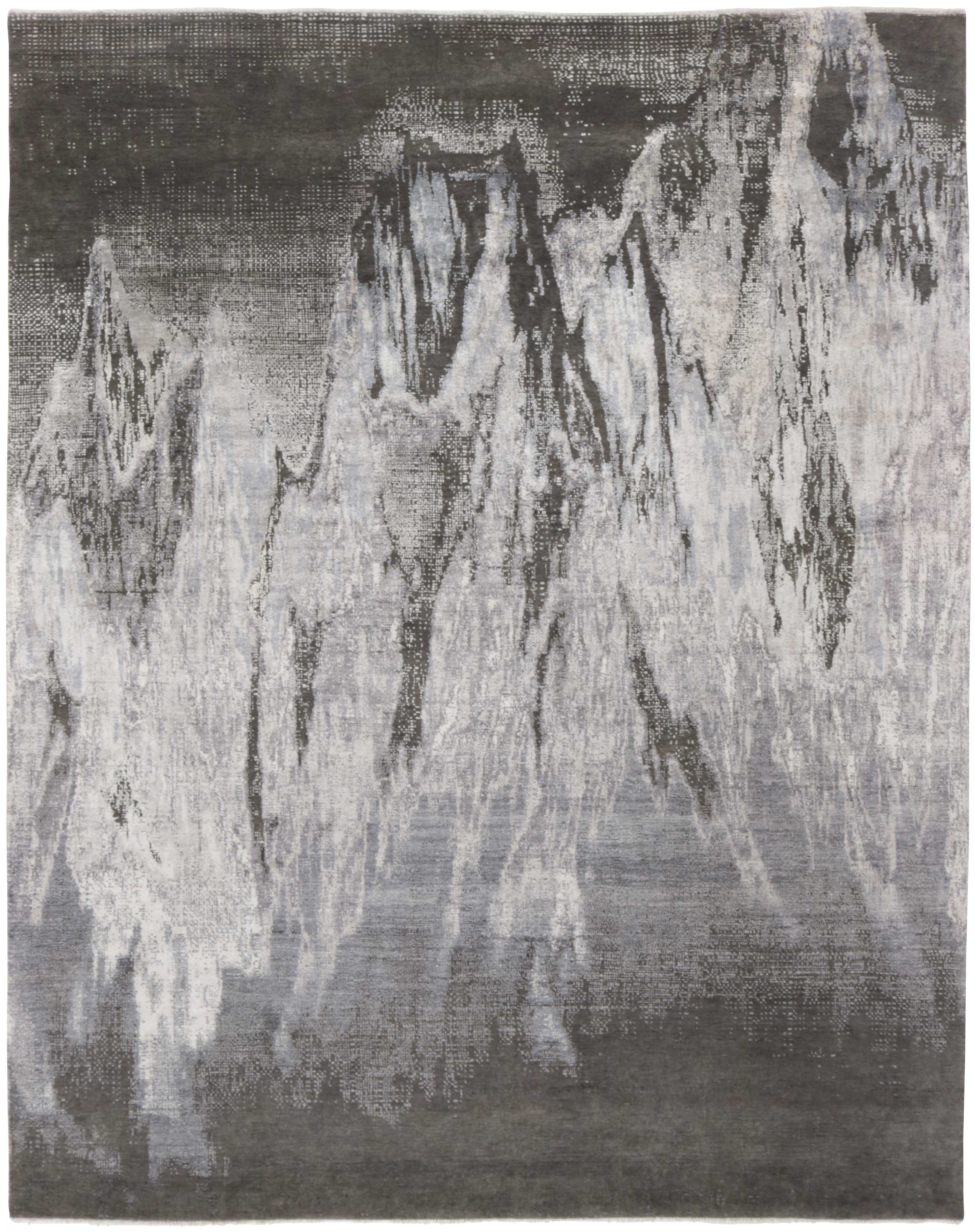 Large area rug with abstract design in grey and charcoal