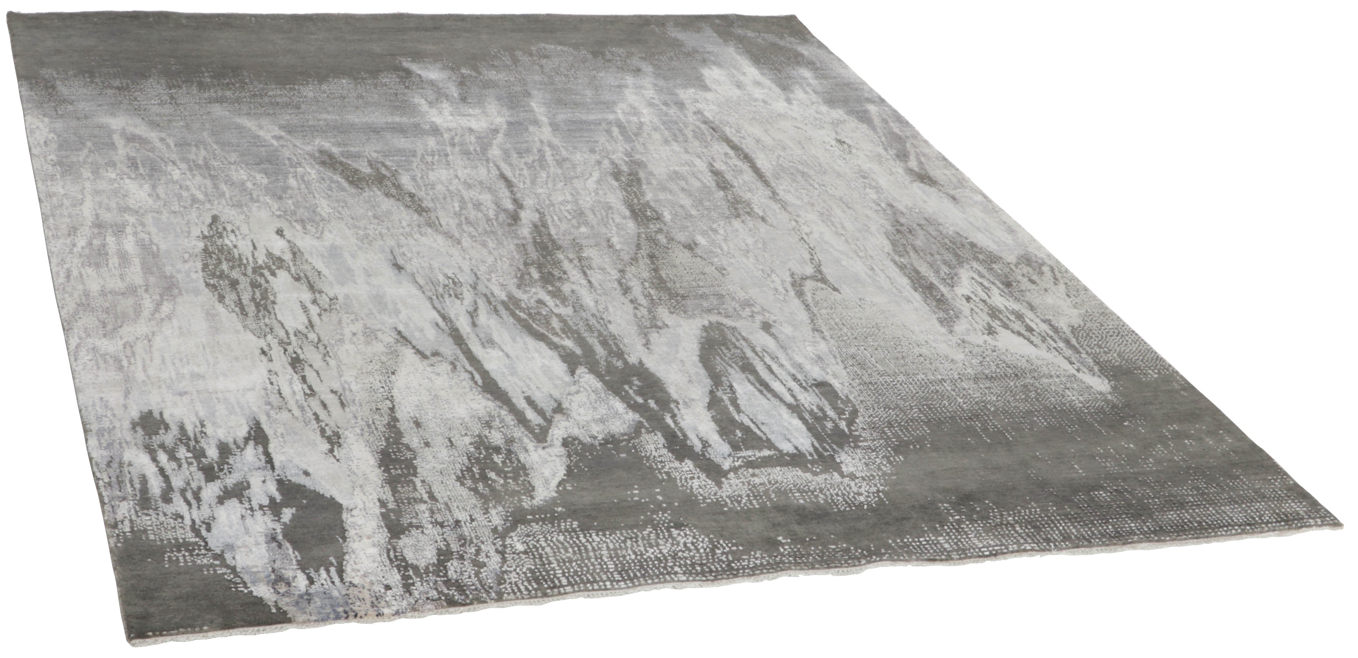 Large area rug with abstract design in grey and charcoal