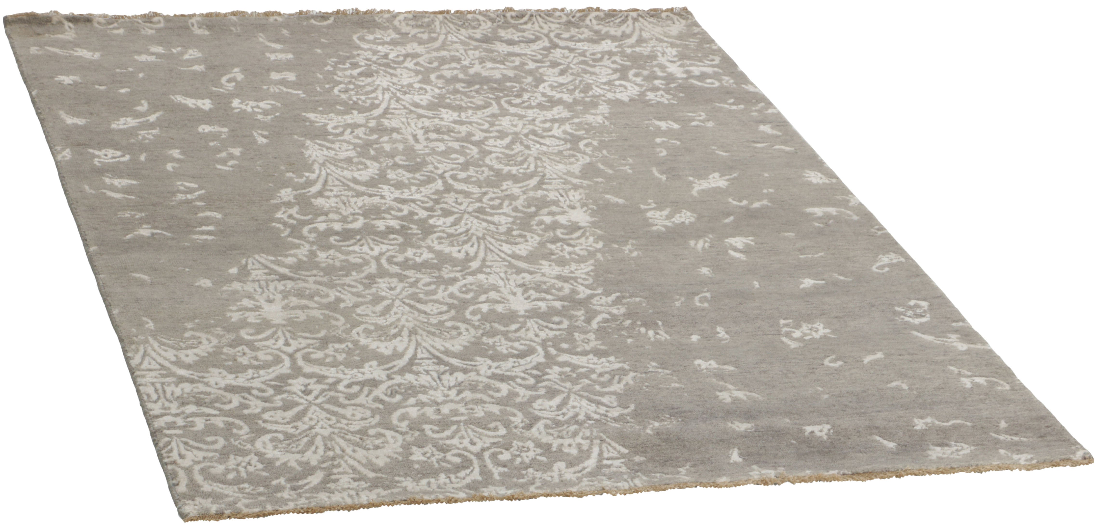 oriental rug with a beige damask pattern