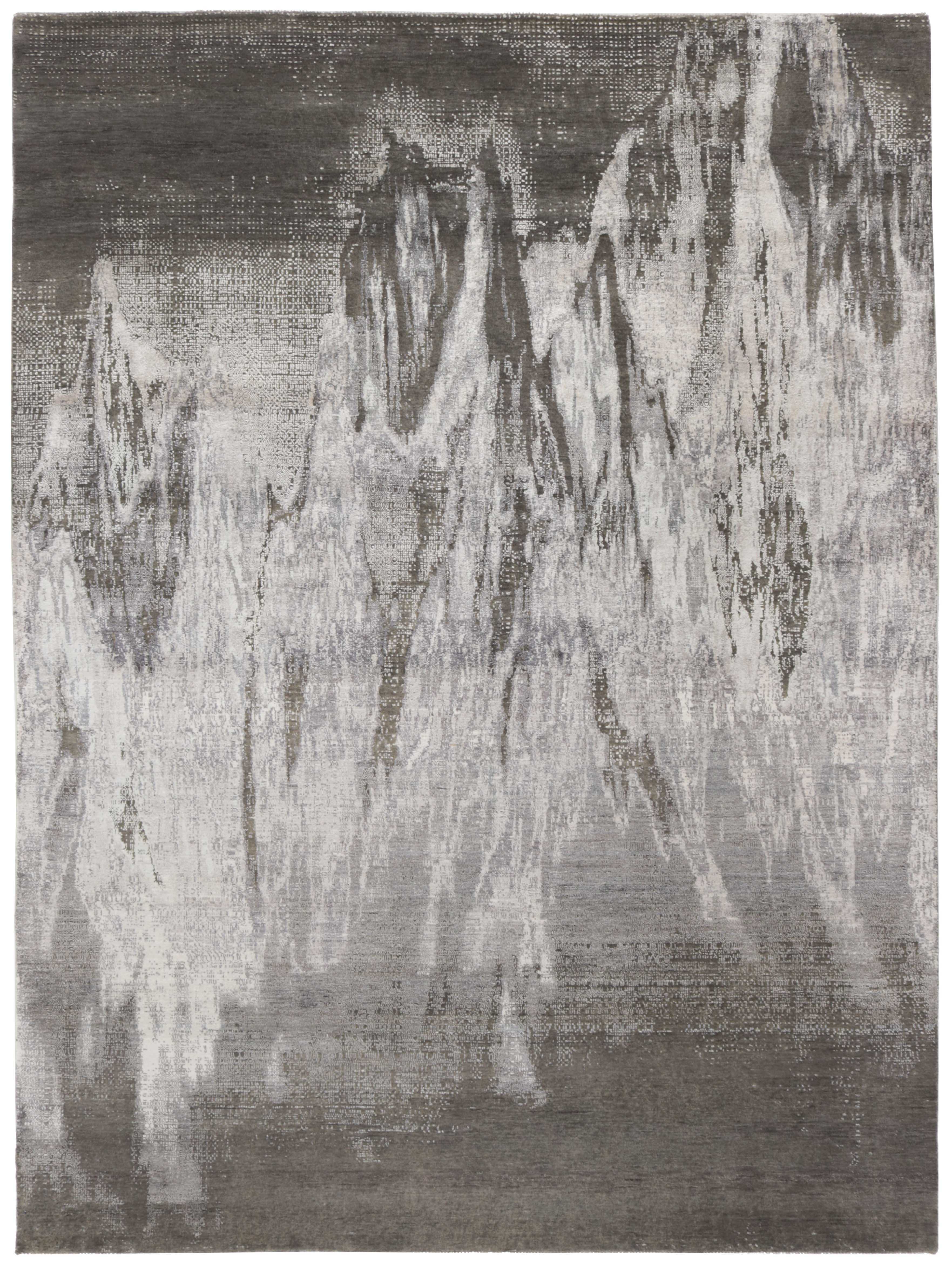Large area rug with abstract design in grey and charcoal