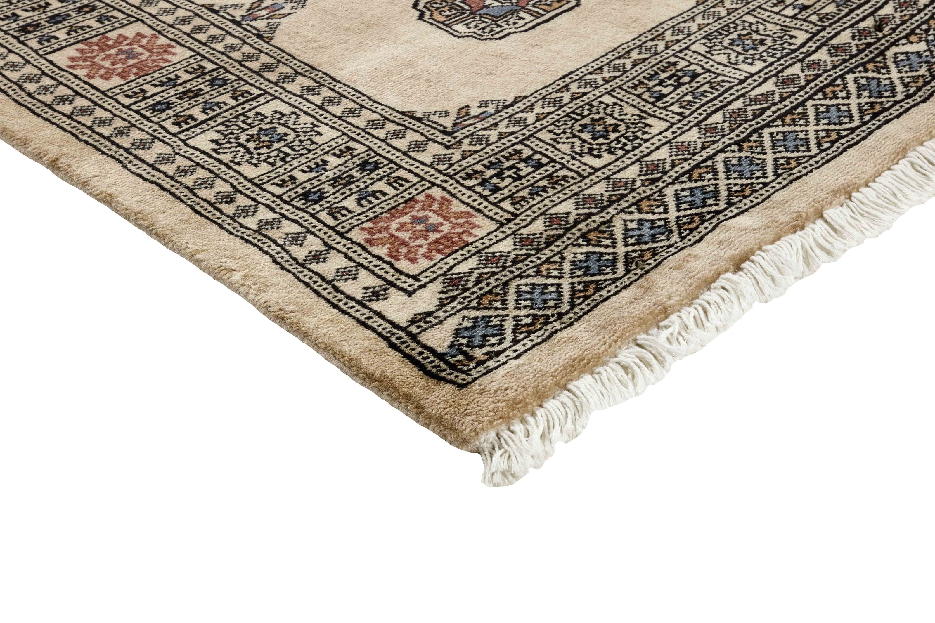 Beige Oriental runner with traditional bordered pattern