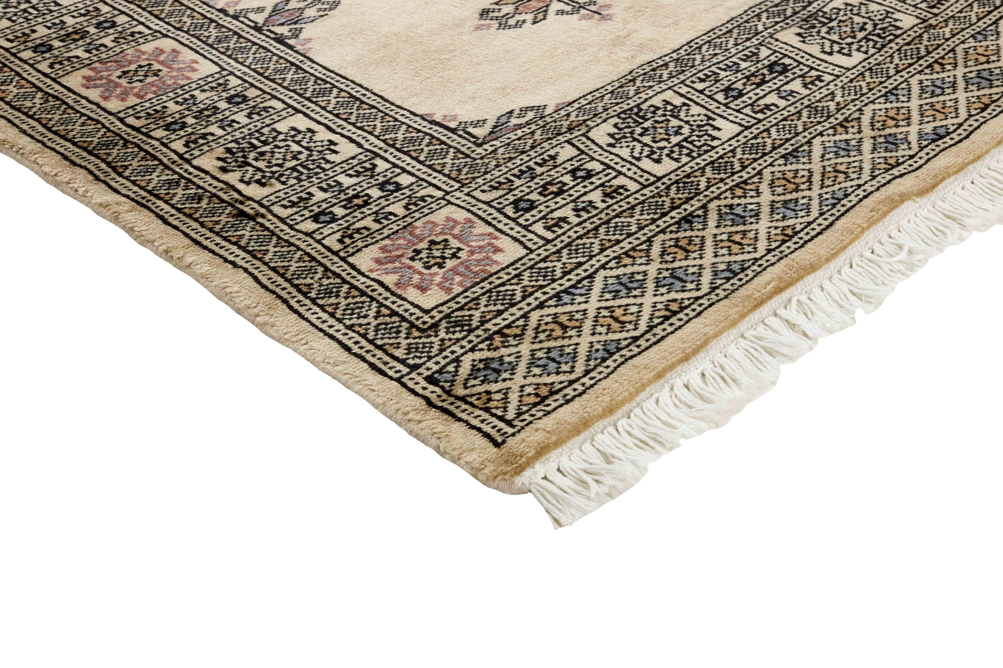 Beige Oriental runner with traditional bordered pattern
