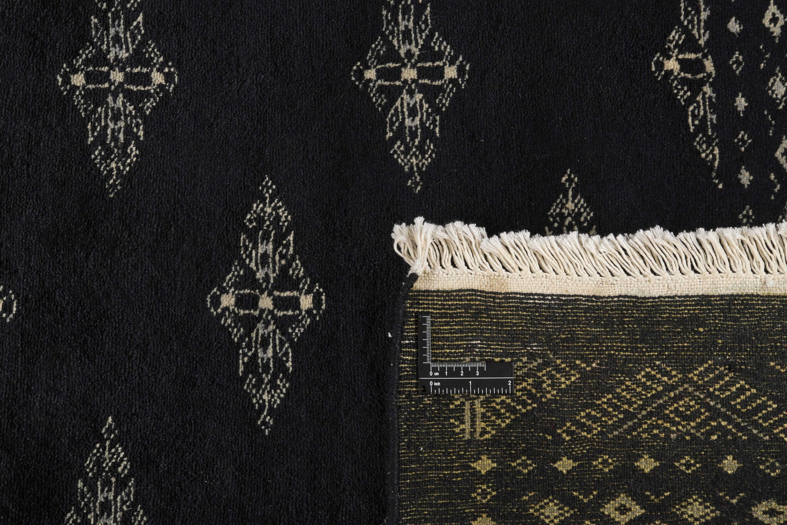 Black Oriental runner with traditional bordered pattern