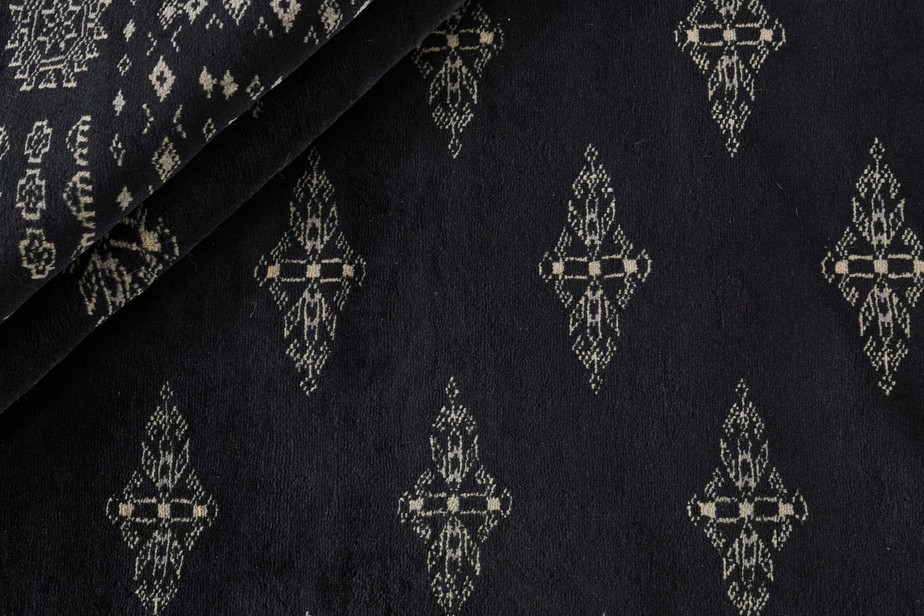 Black Oriental runner with traditional bordered pattern