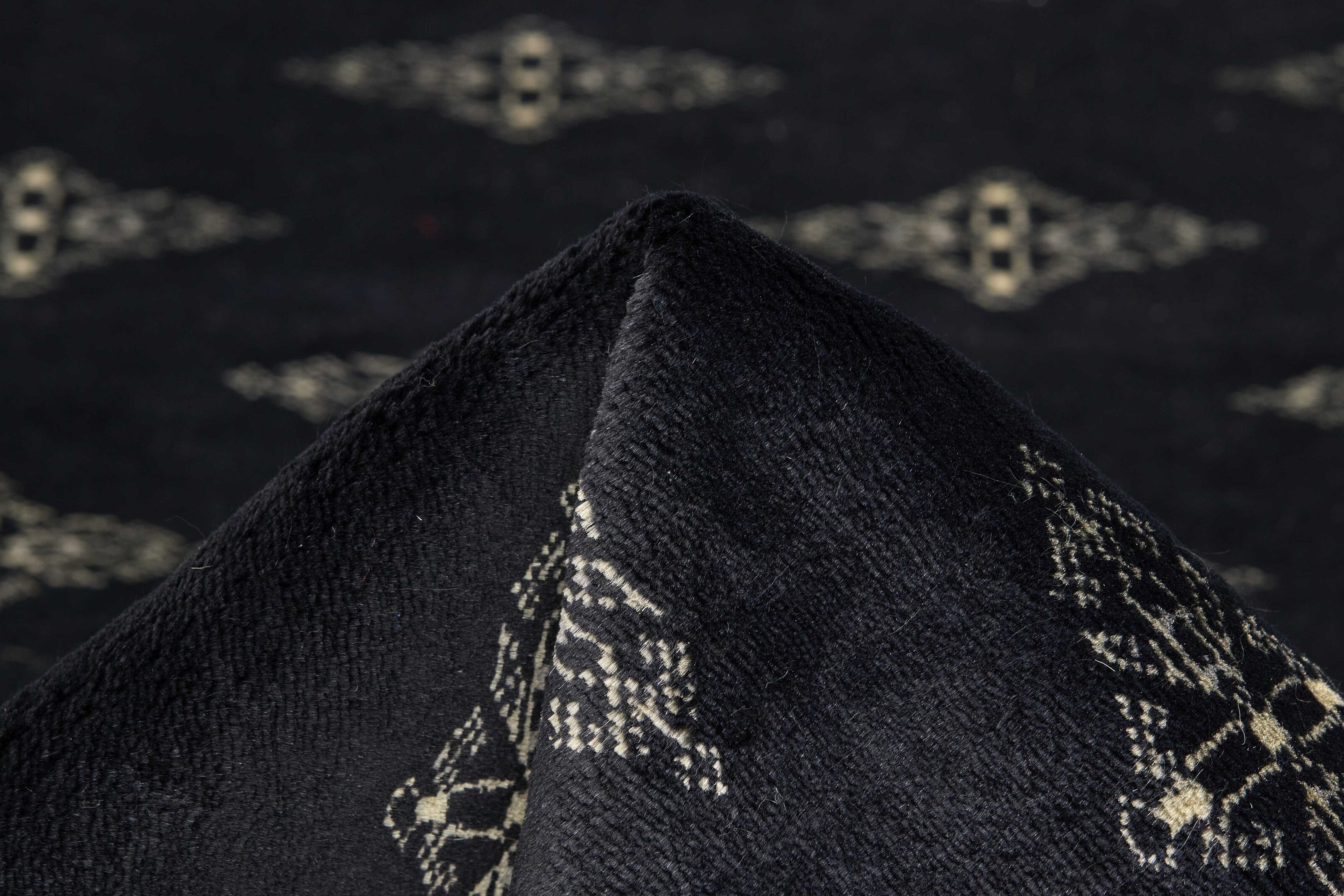 Black Oriental runner with traditional bordered pattern