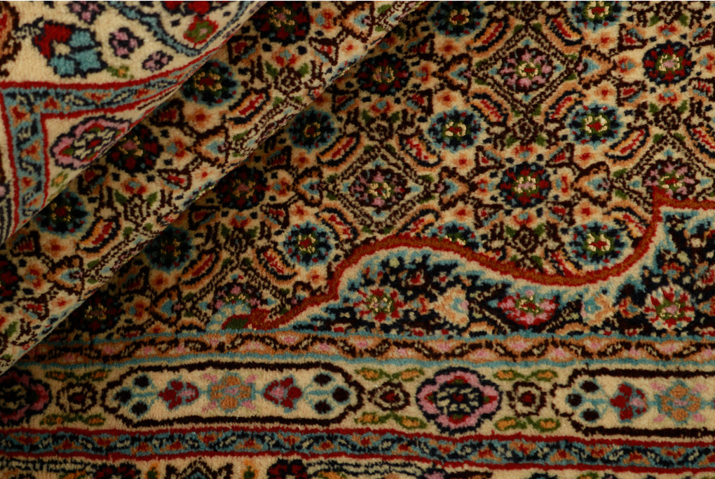 authentic persian rug with traditional floral pattern in cream