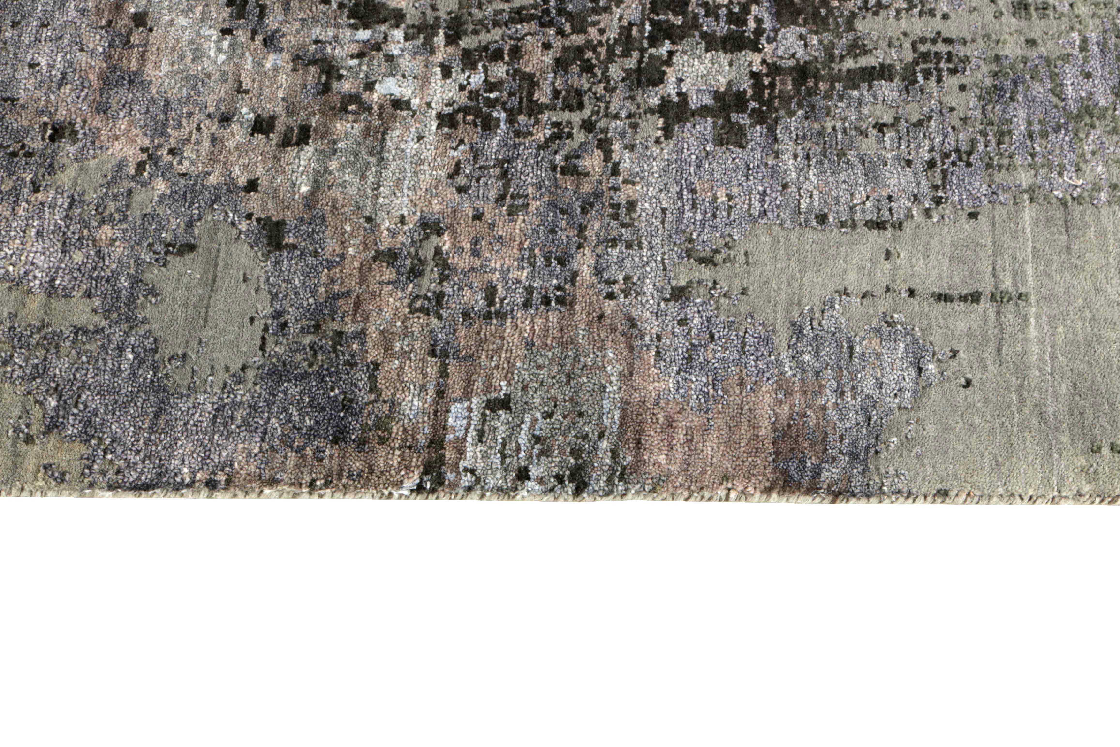 Large area rug with abstract design in grey and taupe