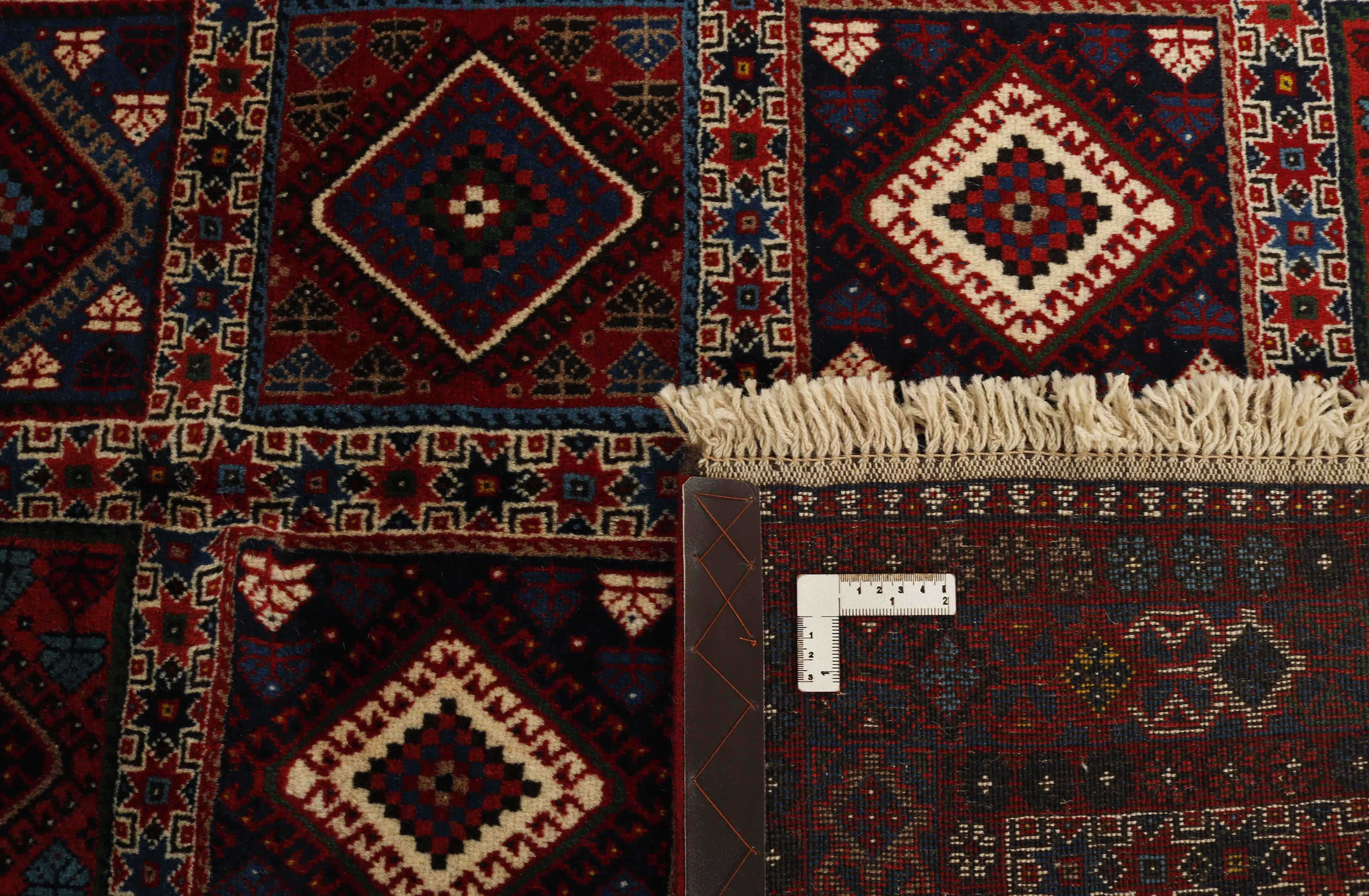 red Authentic persian rug with a traditional design