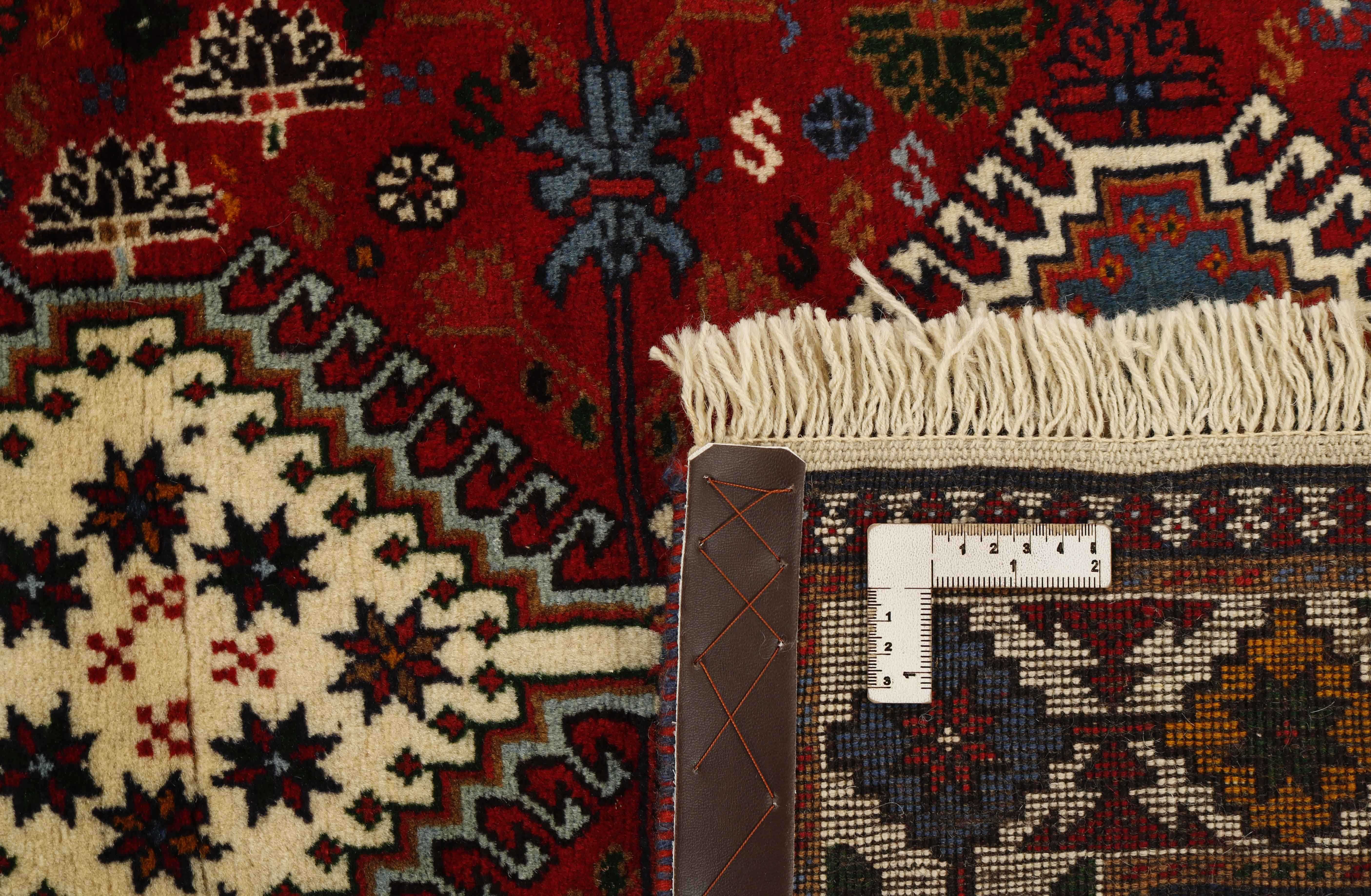 red Authentic persian rug with a traditional design