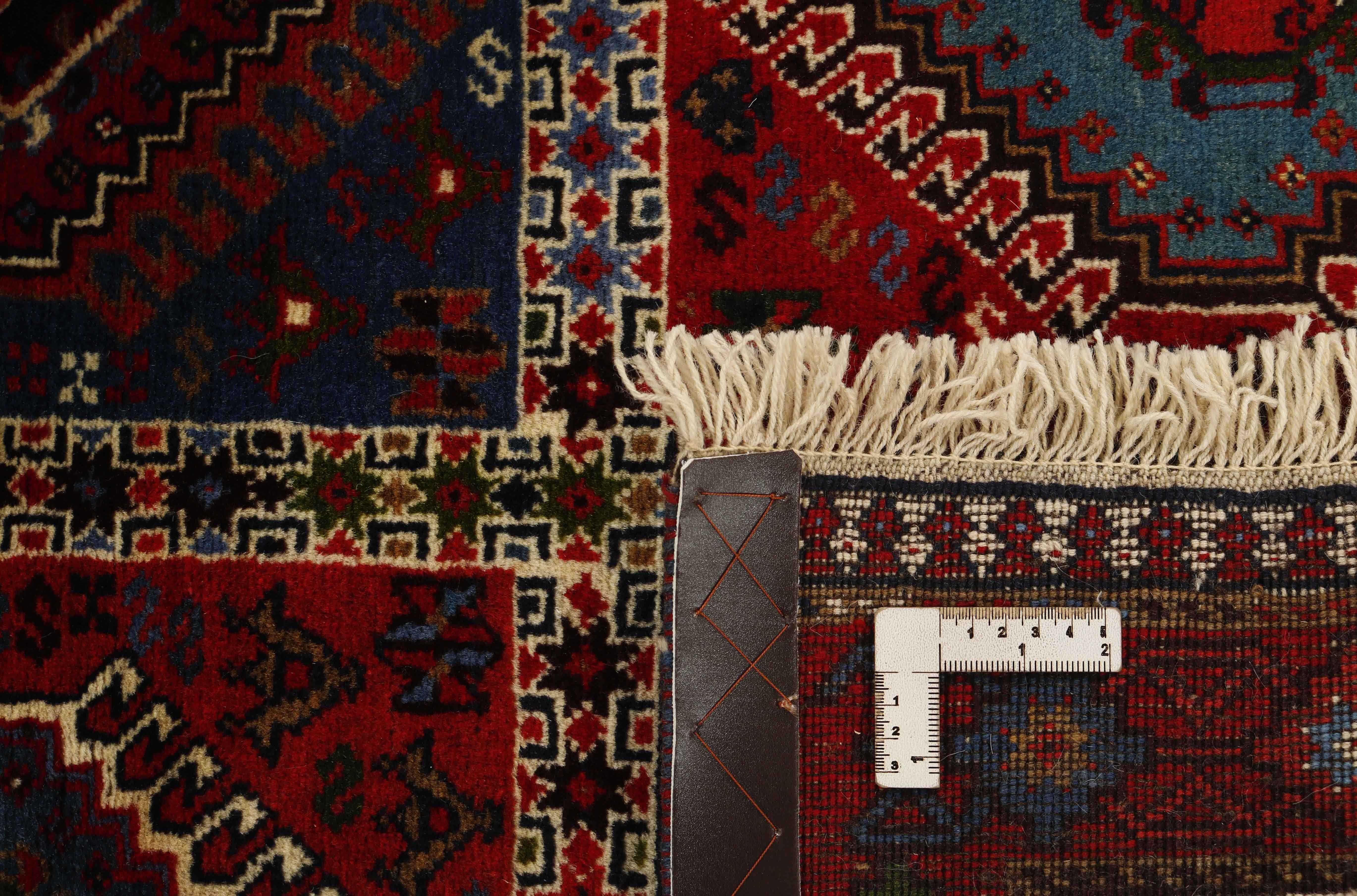 red authentic persian rug with a traditional design
