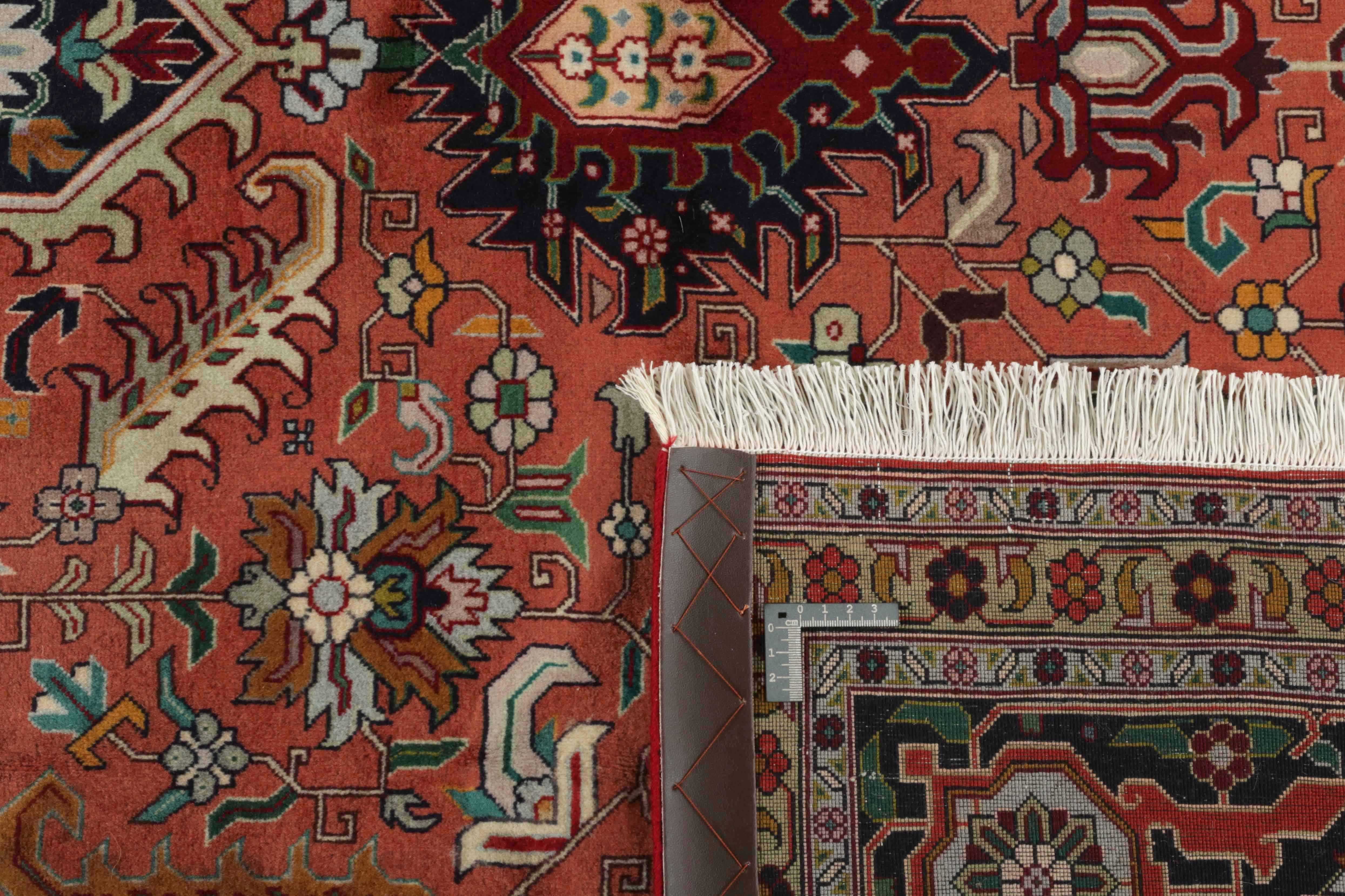 Authentic persian rug with traditional floral design in red