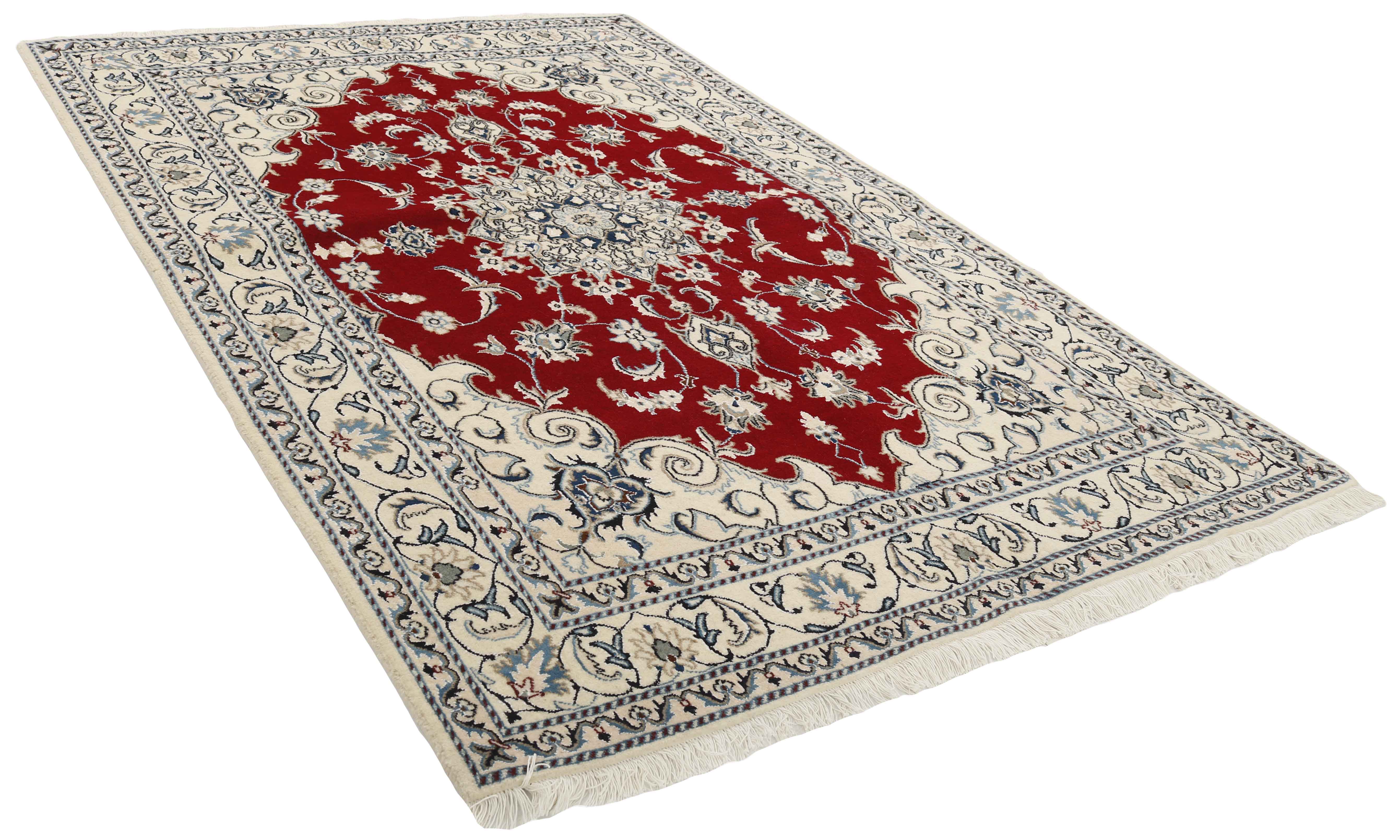 Authentic persian rug with a traditional floral design in cream and red