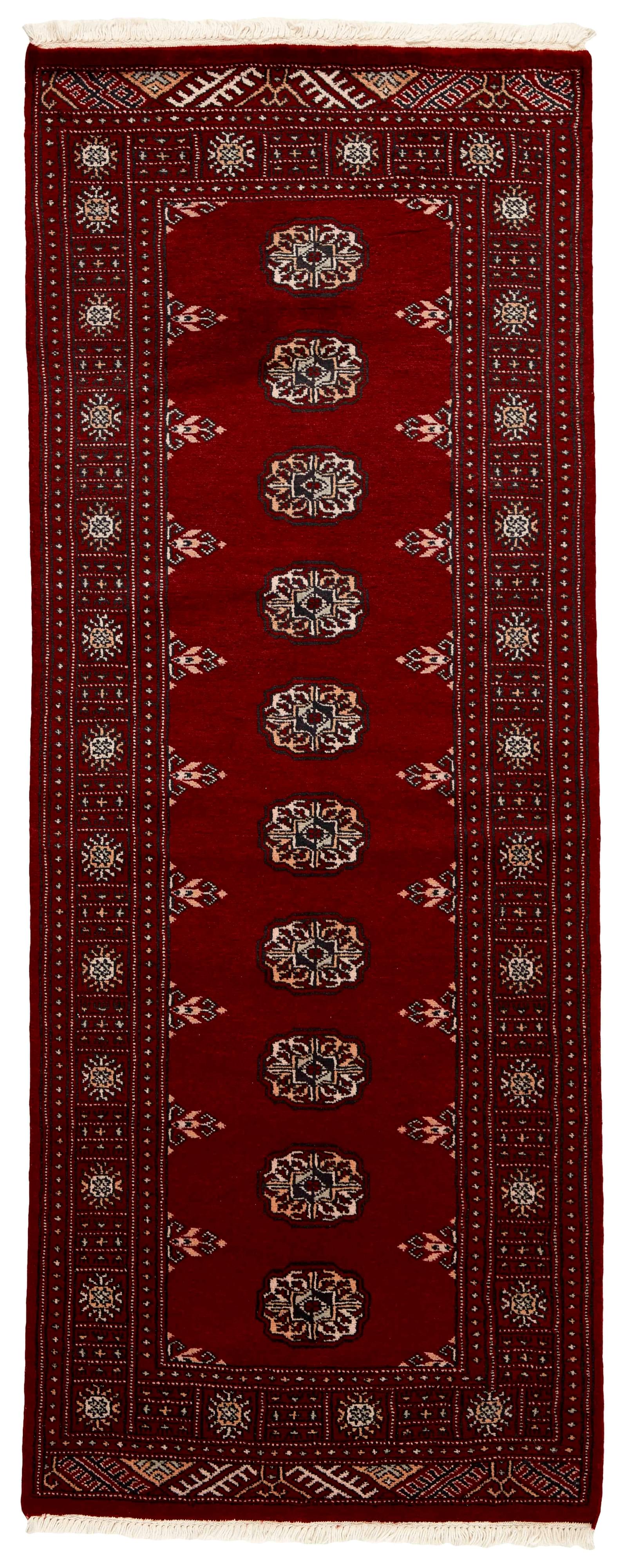 red oriental runner with traditional gul pattern