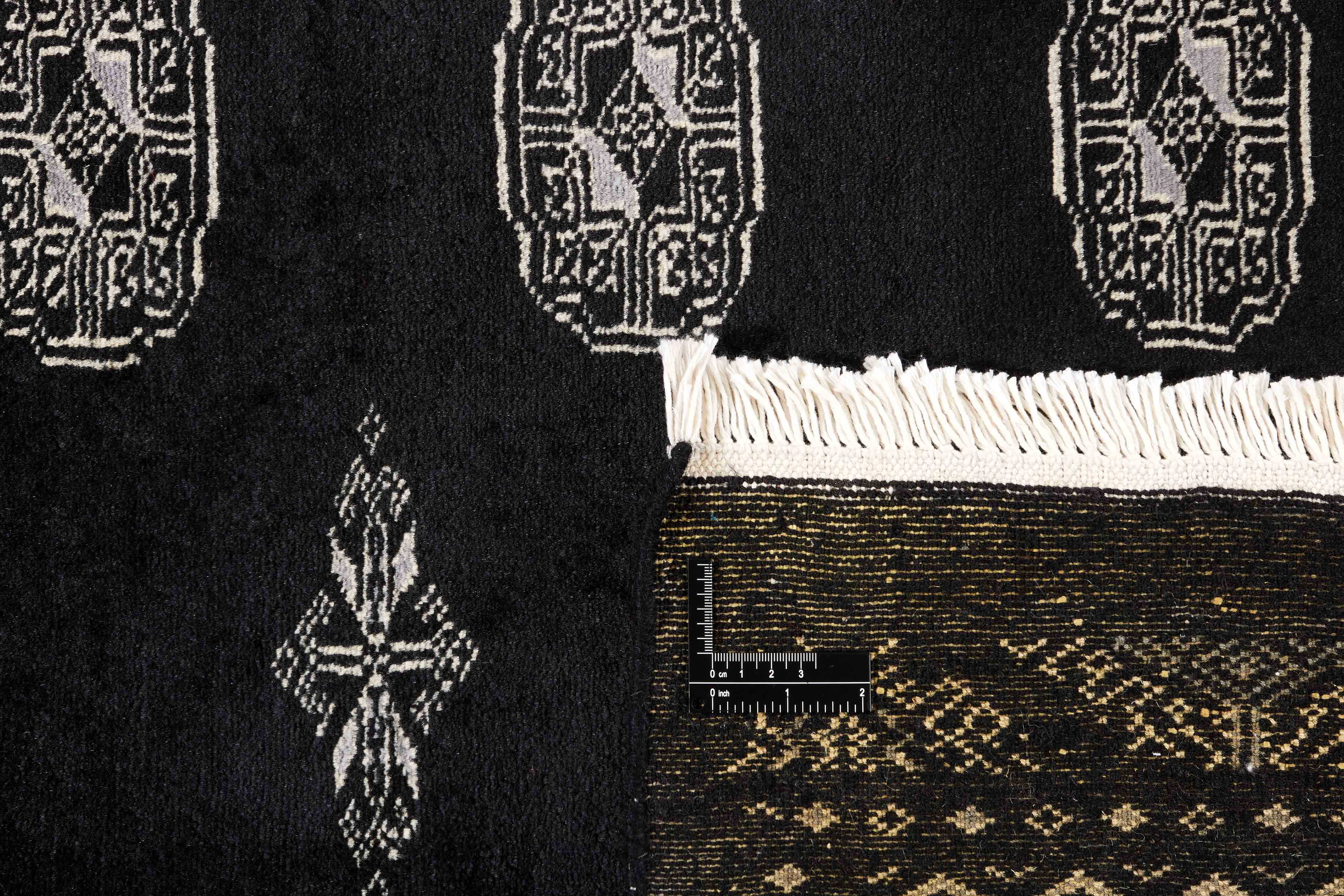 black oriental rug with traditional pattern