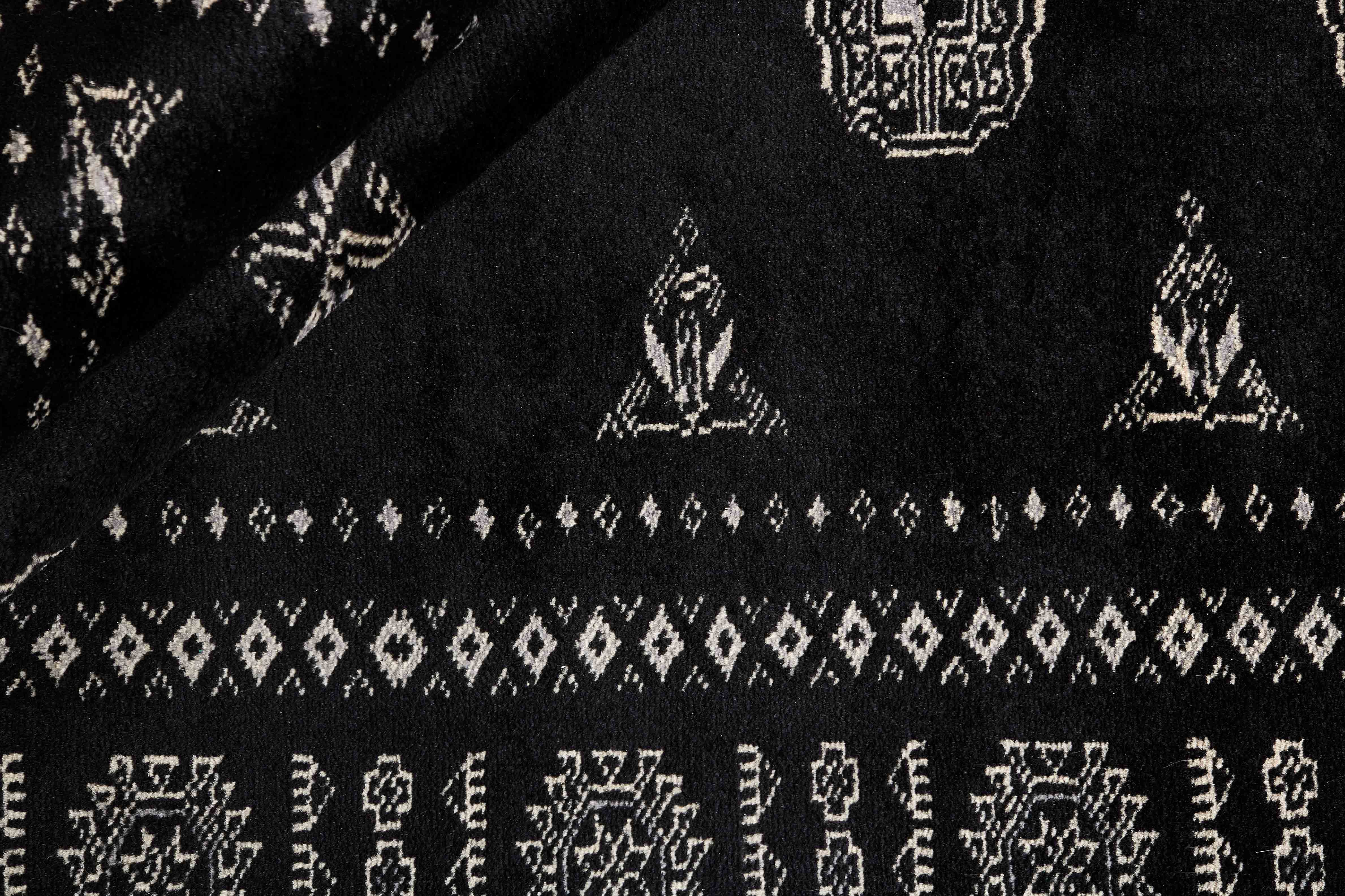 black oriental rug with traditional pattern