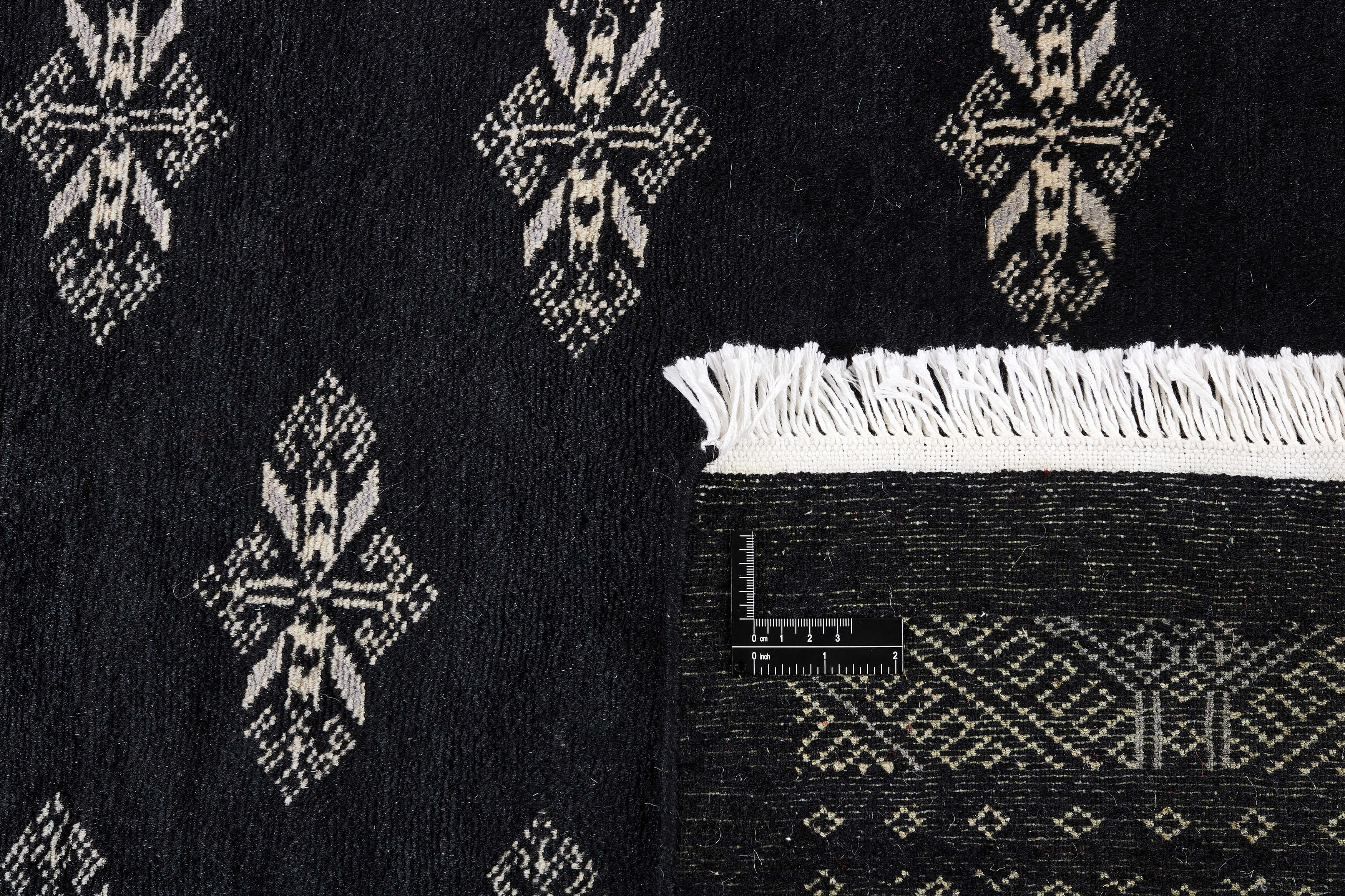 black oriental rug with traditional pattern