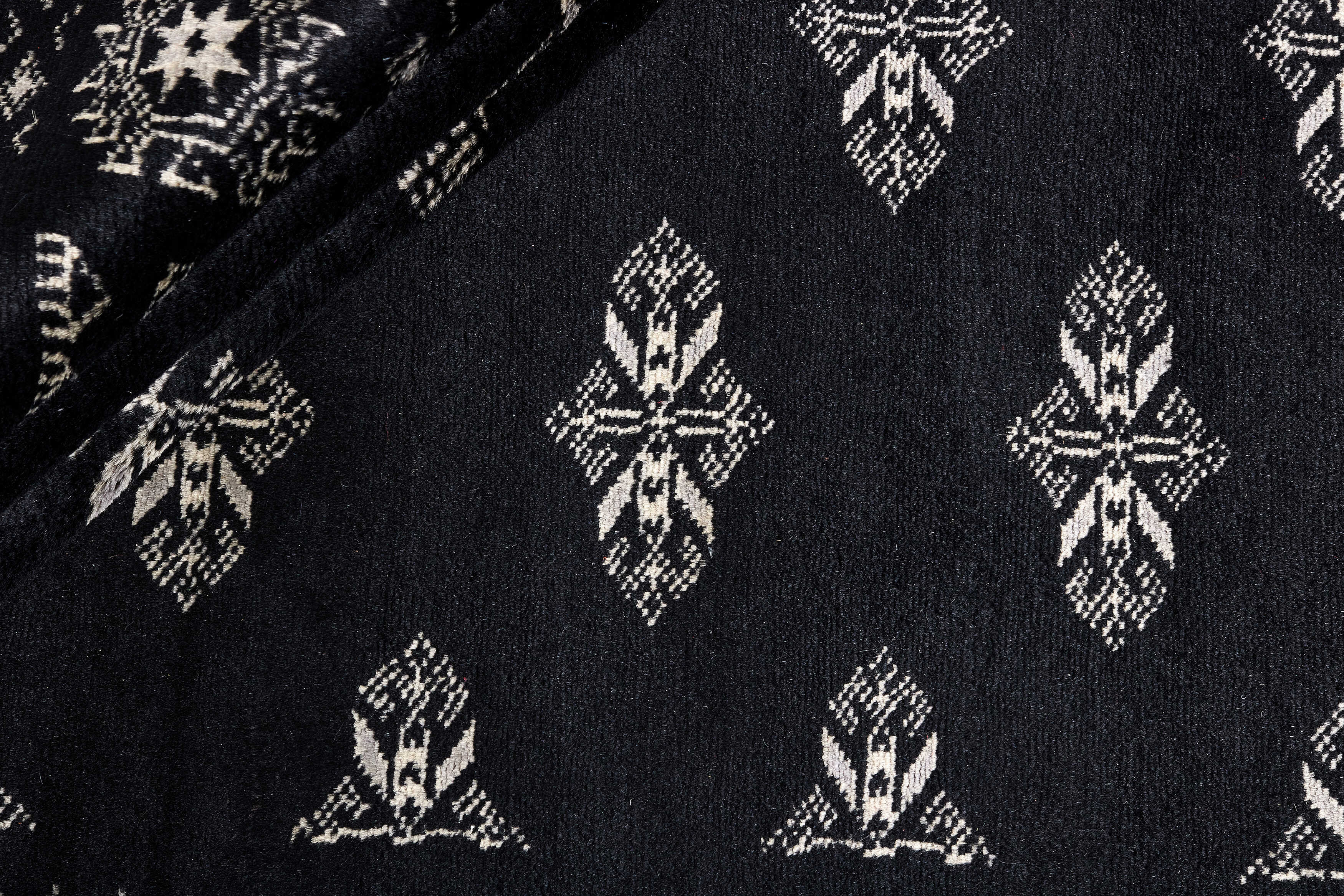 black oriental rug with traditional pattern