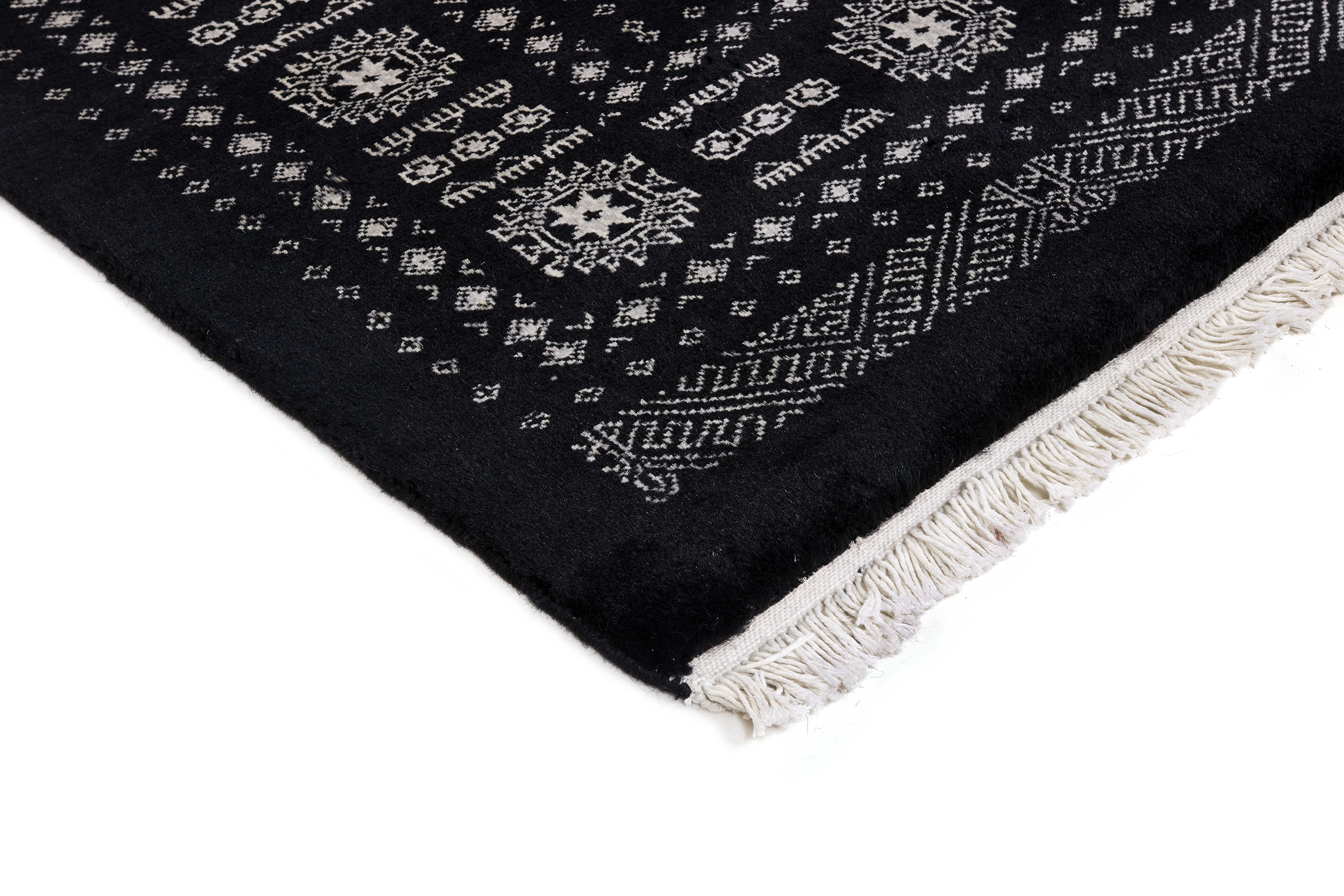 black oriental rug with traditional pattern