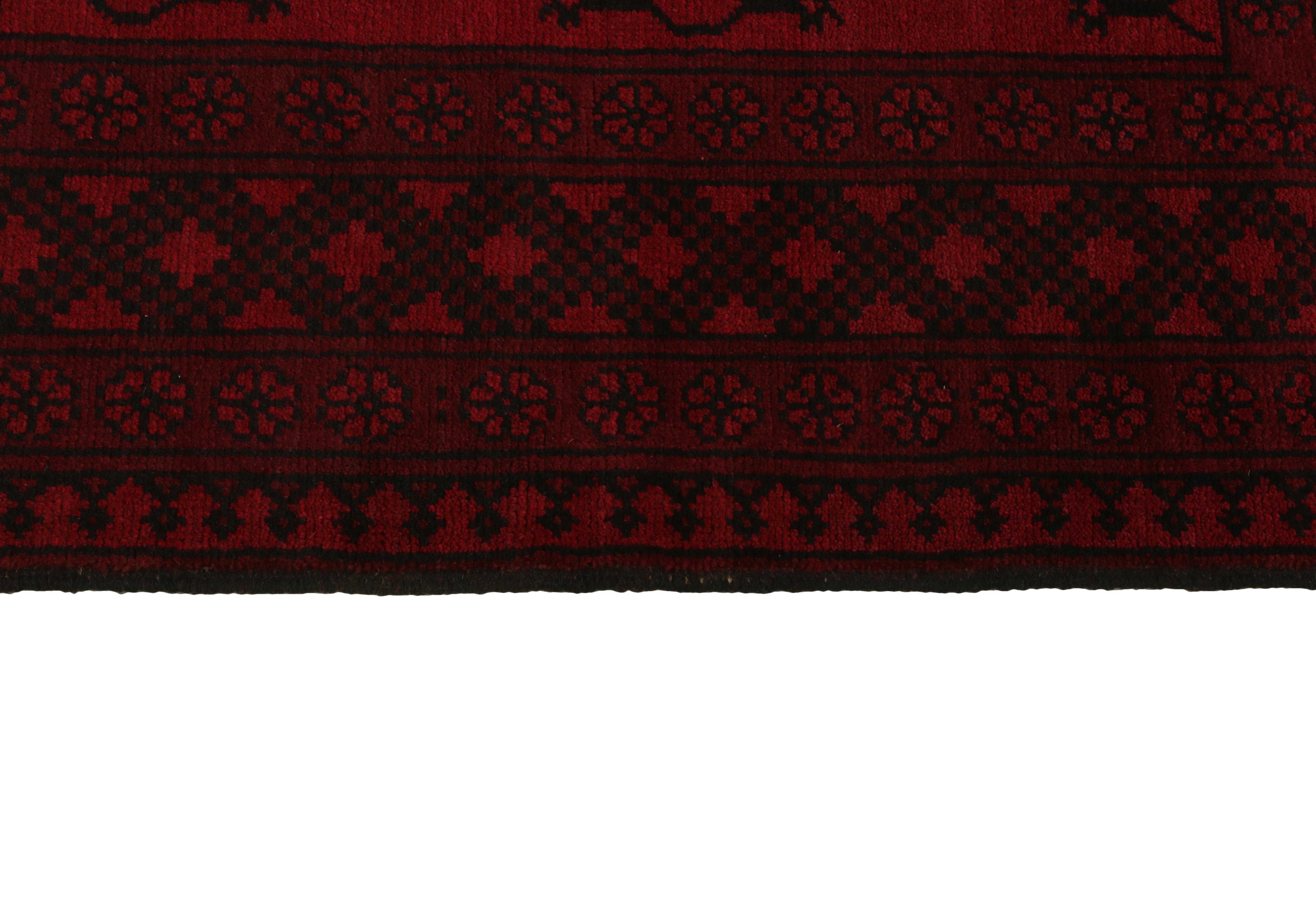 Red oriental rug with traditional elephant's foot pattern