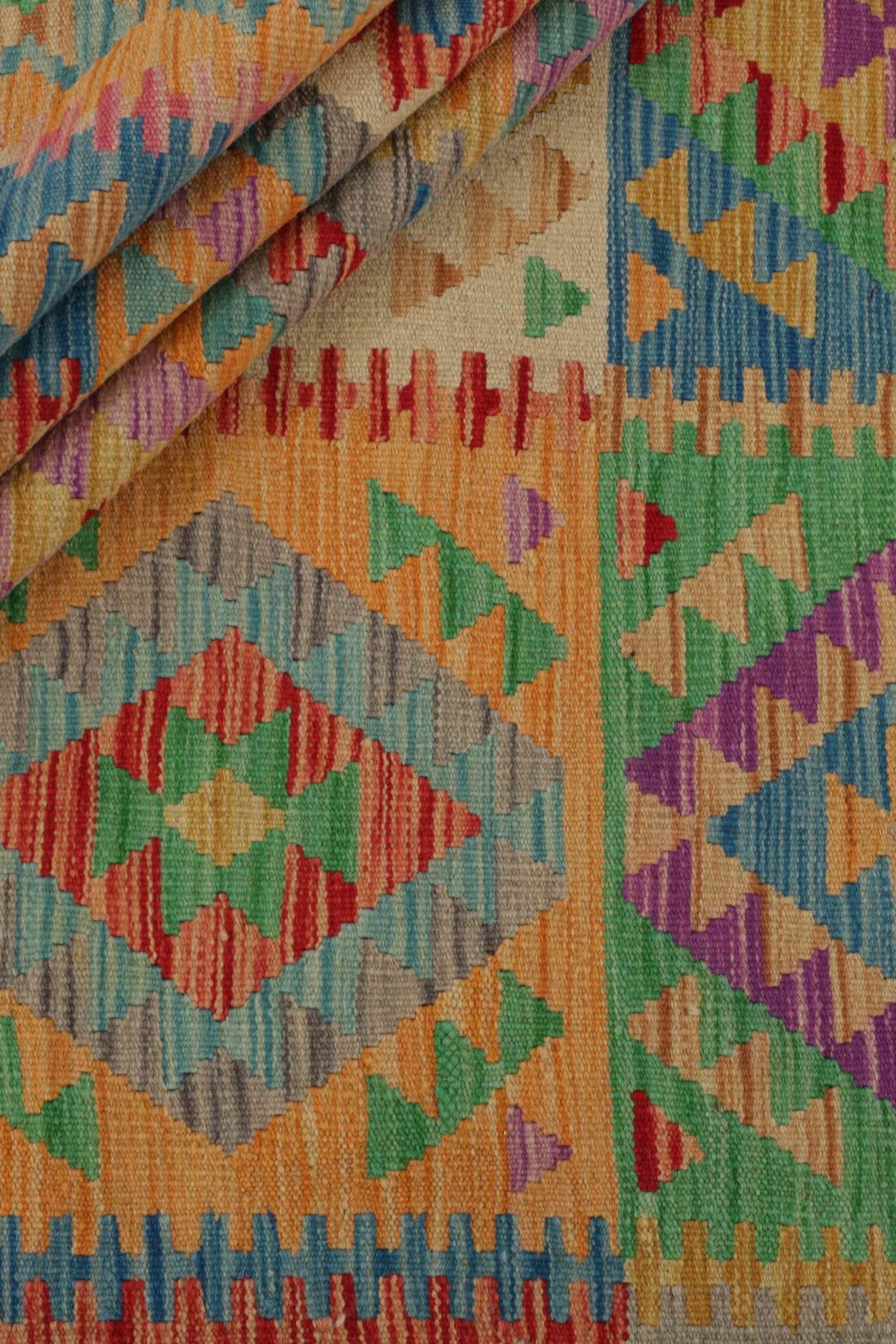 Authentic Afghan Kelim flatweave rug with traditional multicolour pattern.