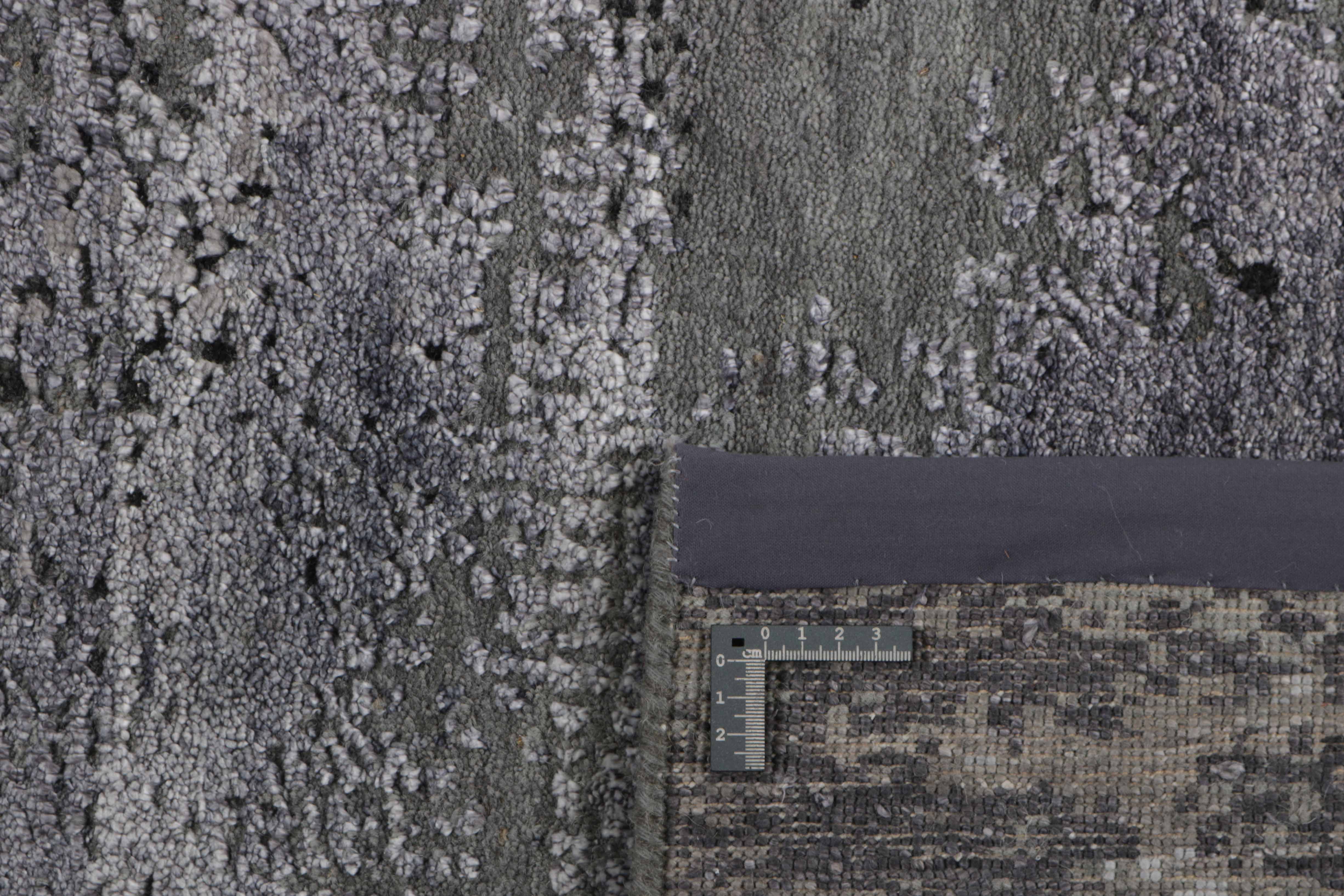 Large area rug with abstract design in grey and taupe