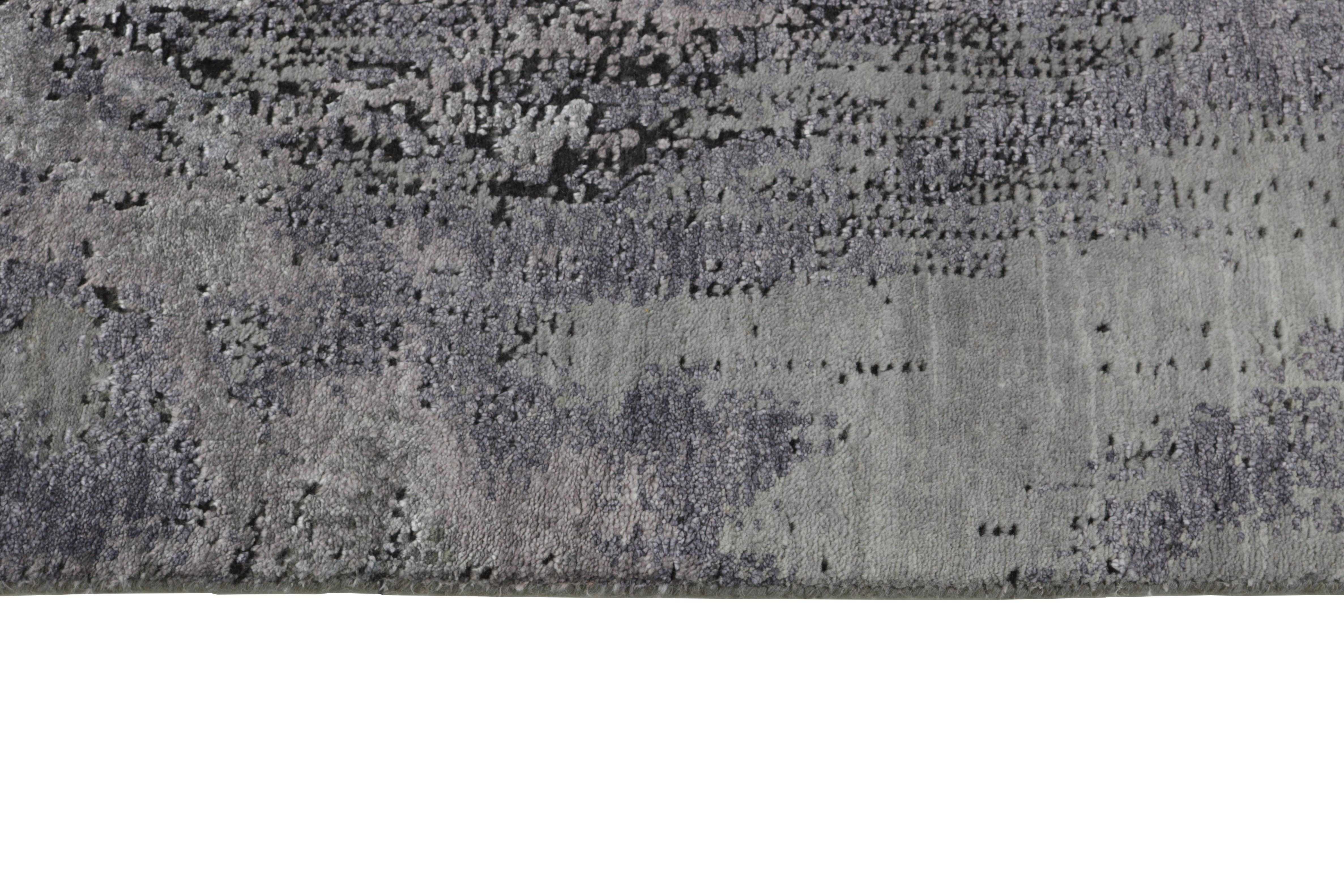 Large area rug with abstract design in grey and taupe