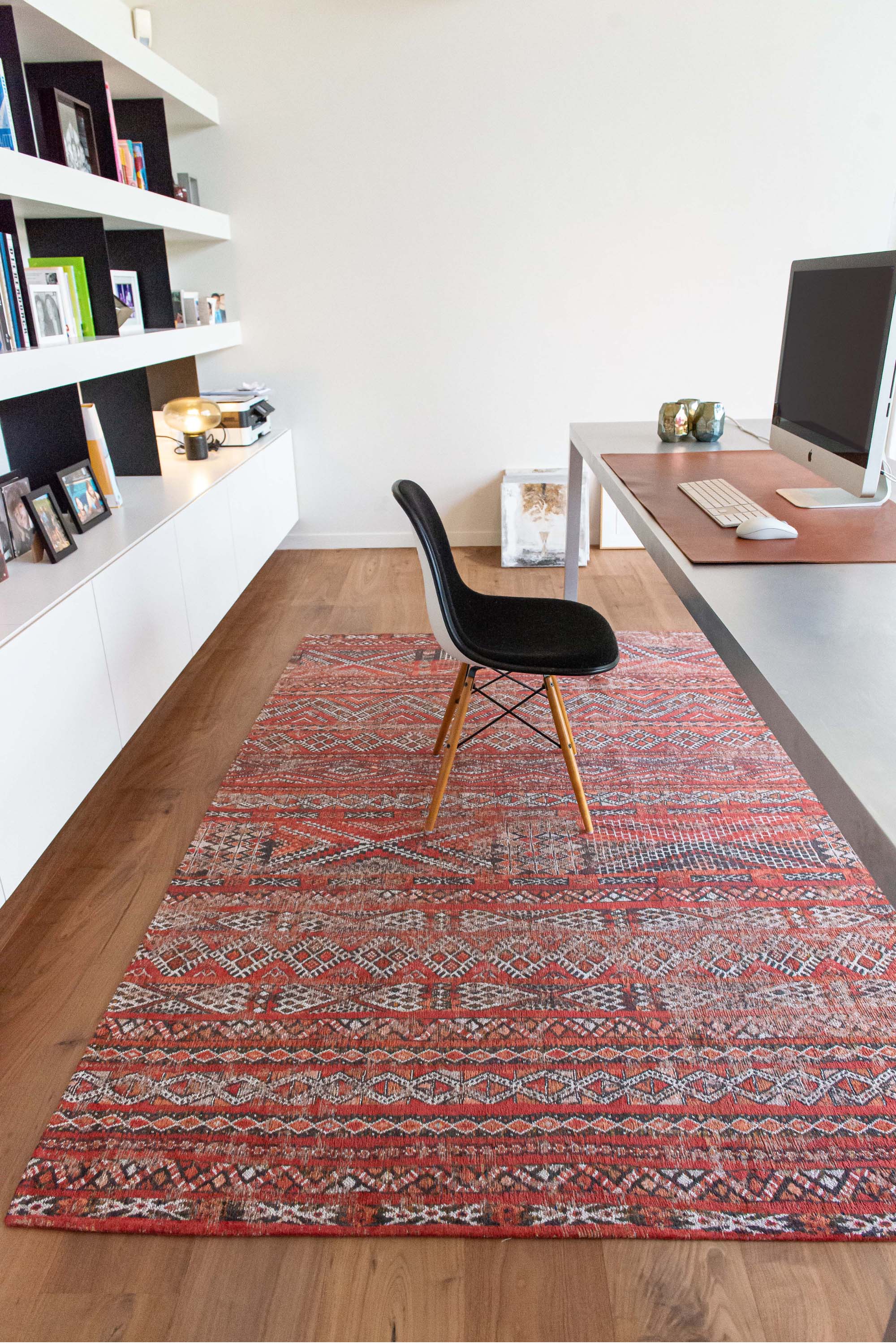 red rug with a moroccan geometric pattern