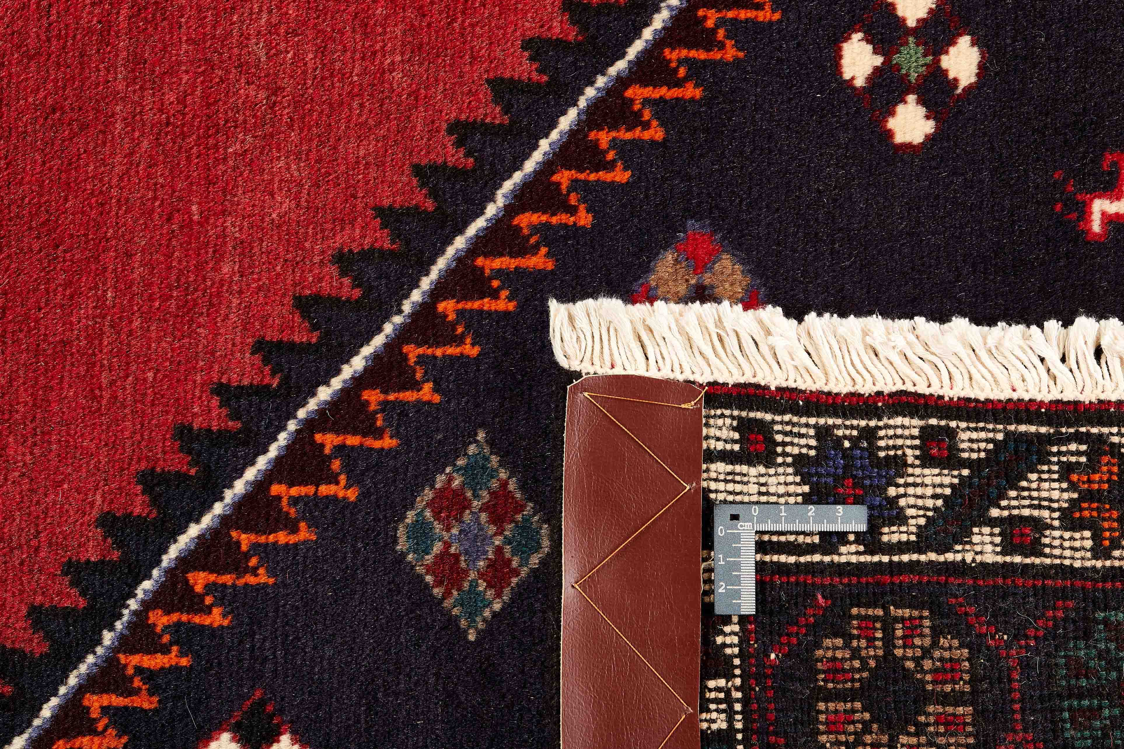 Authentic persian rug with a traditional geometric pattern in red