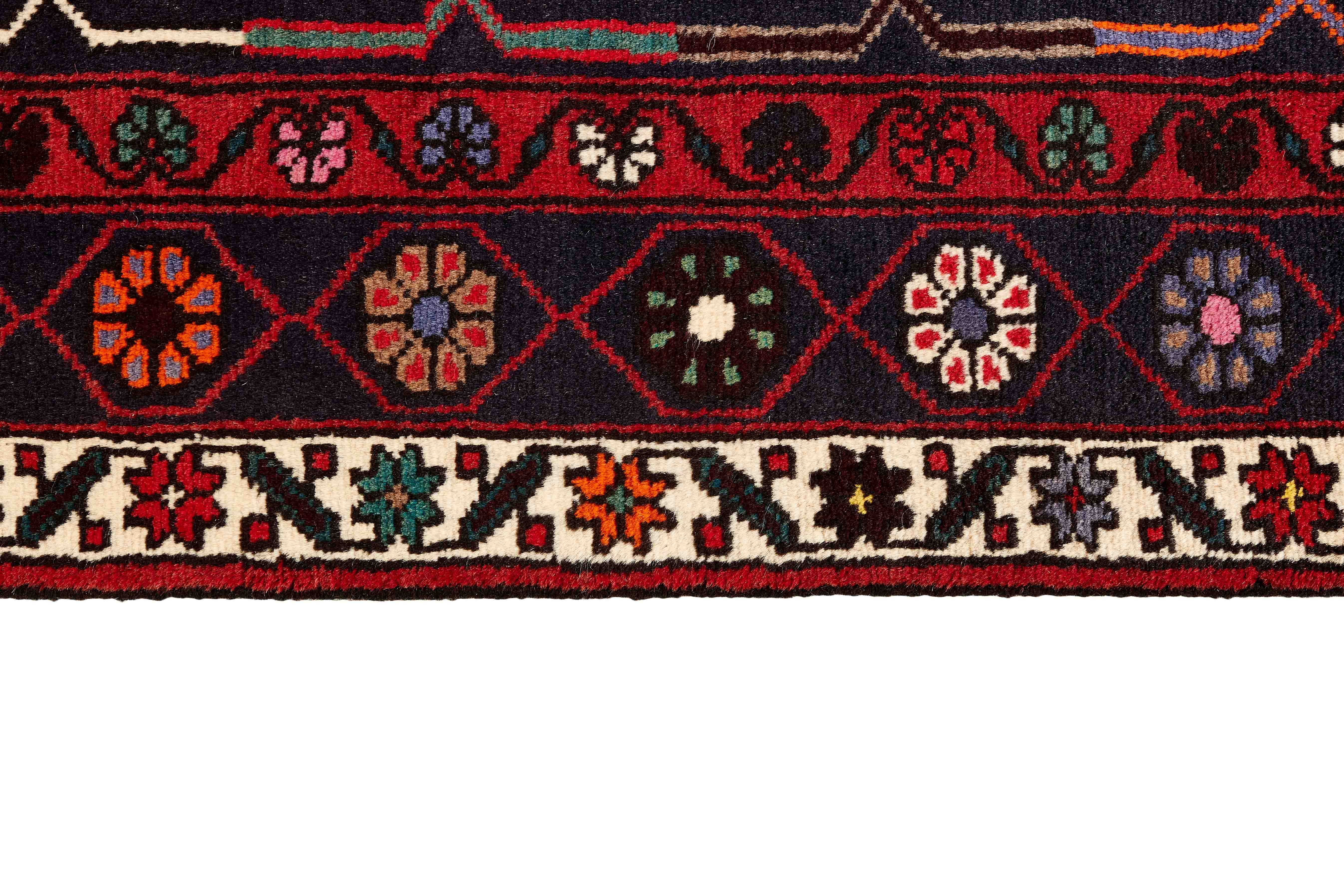 Authentic persian rug with a traditional geometric pattern in red