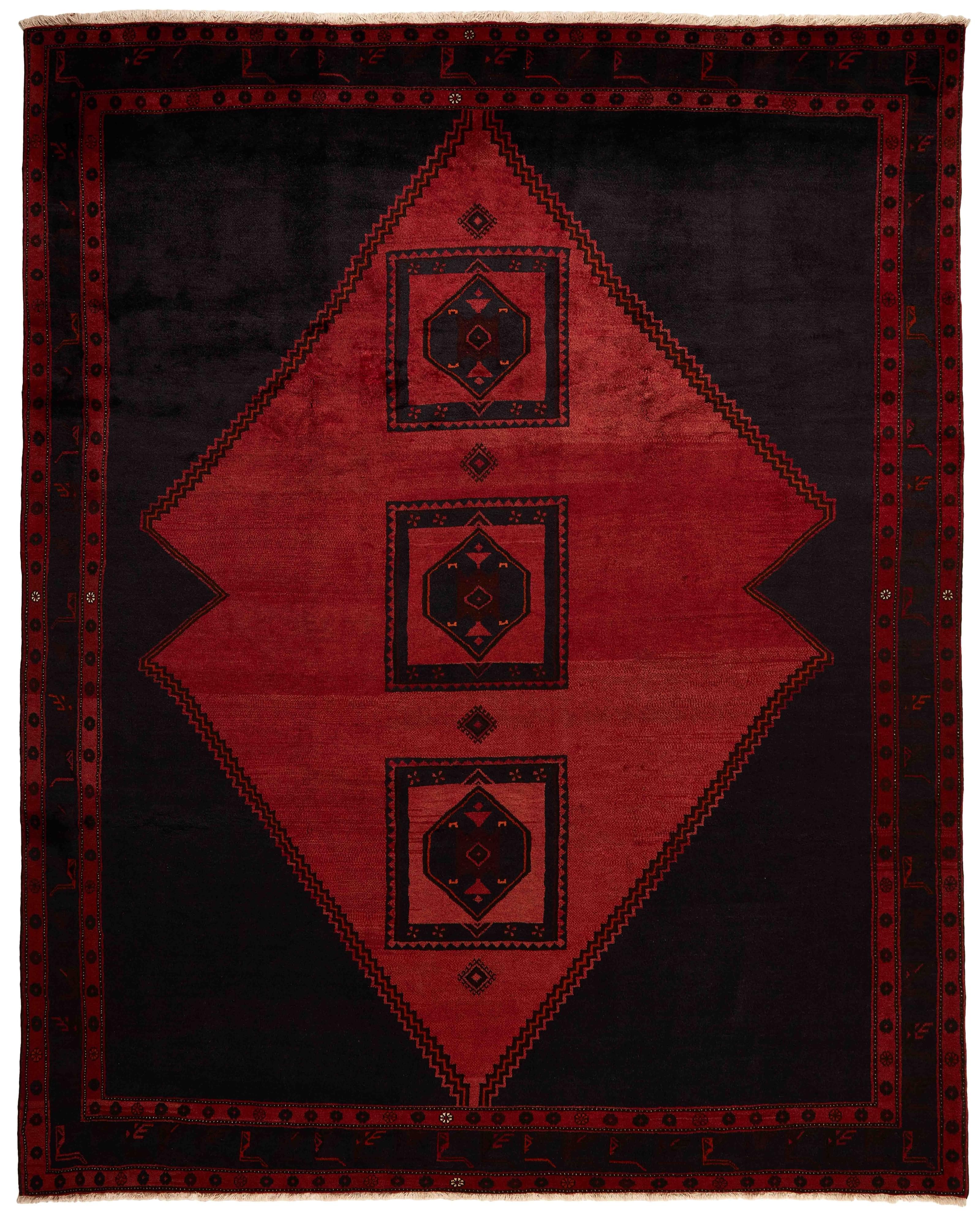 Authentic persian rug with a traditional tribal geometric pattern in red