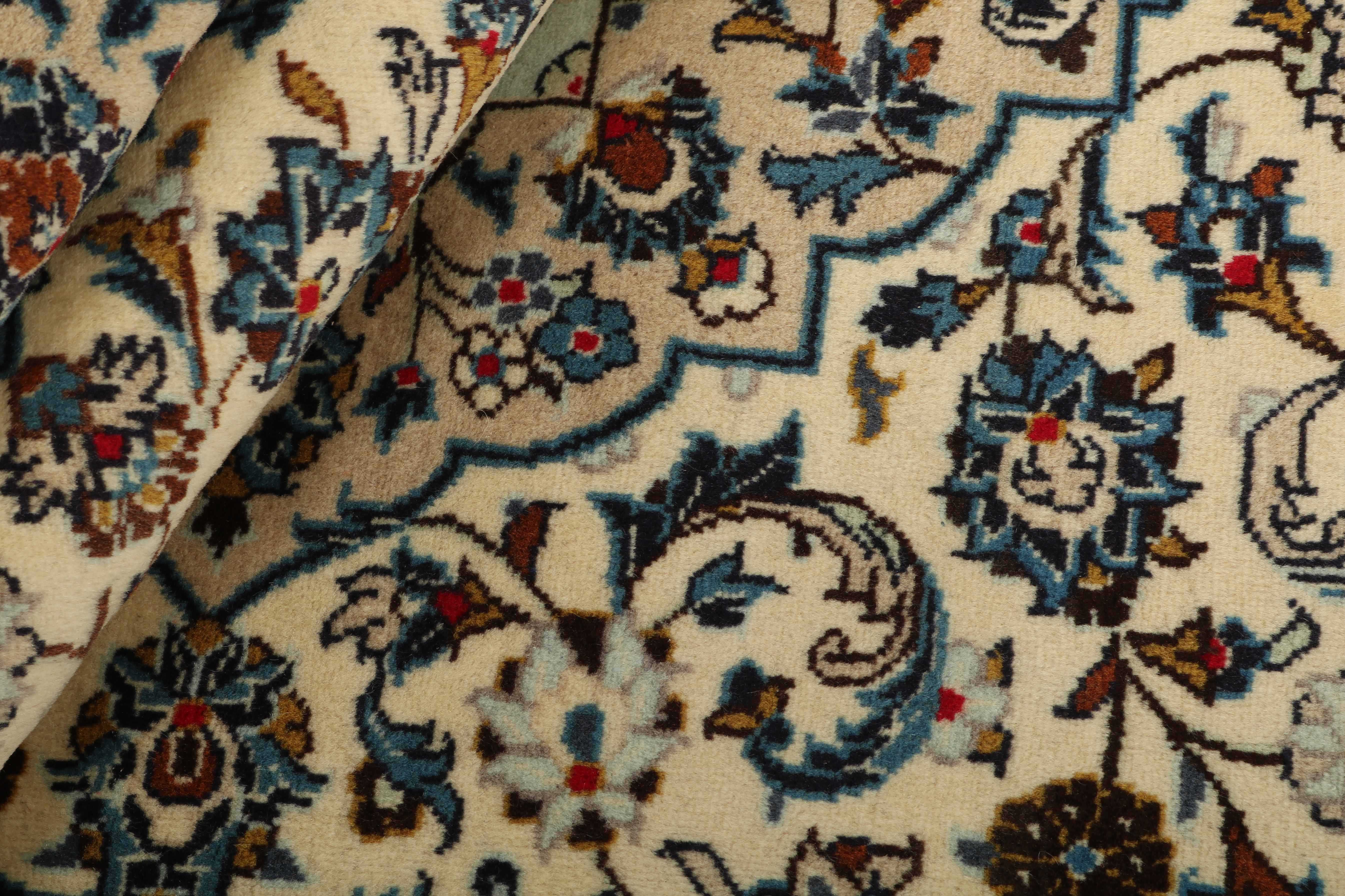 Authentic persian rug with traditional floral design in beige and blue