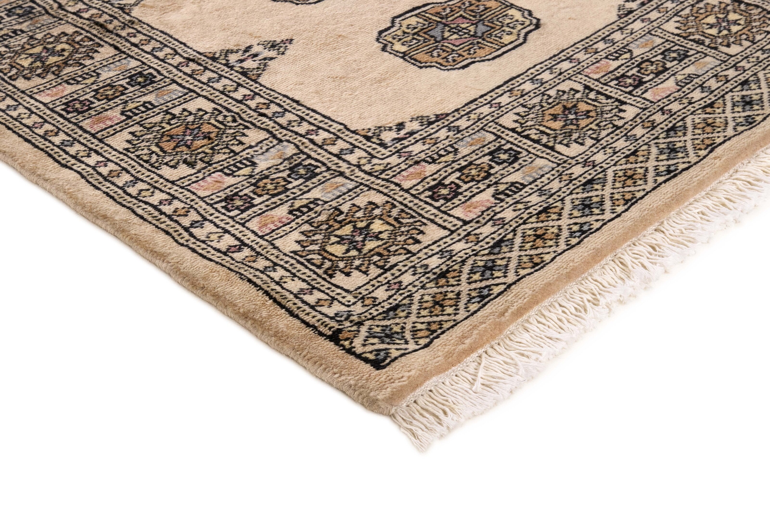Beige Oriental rug with traditional bordered pattern