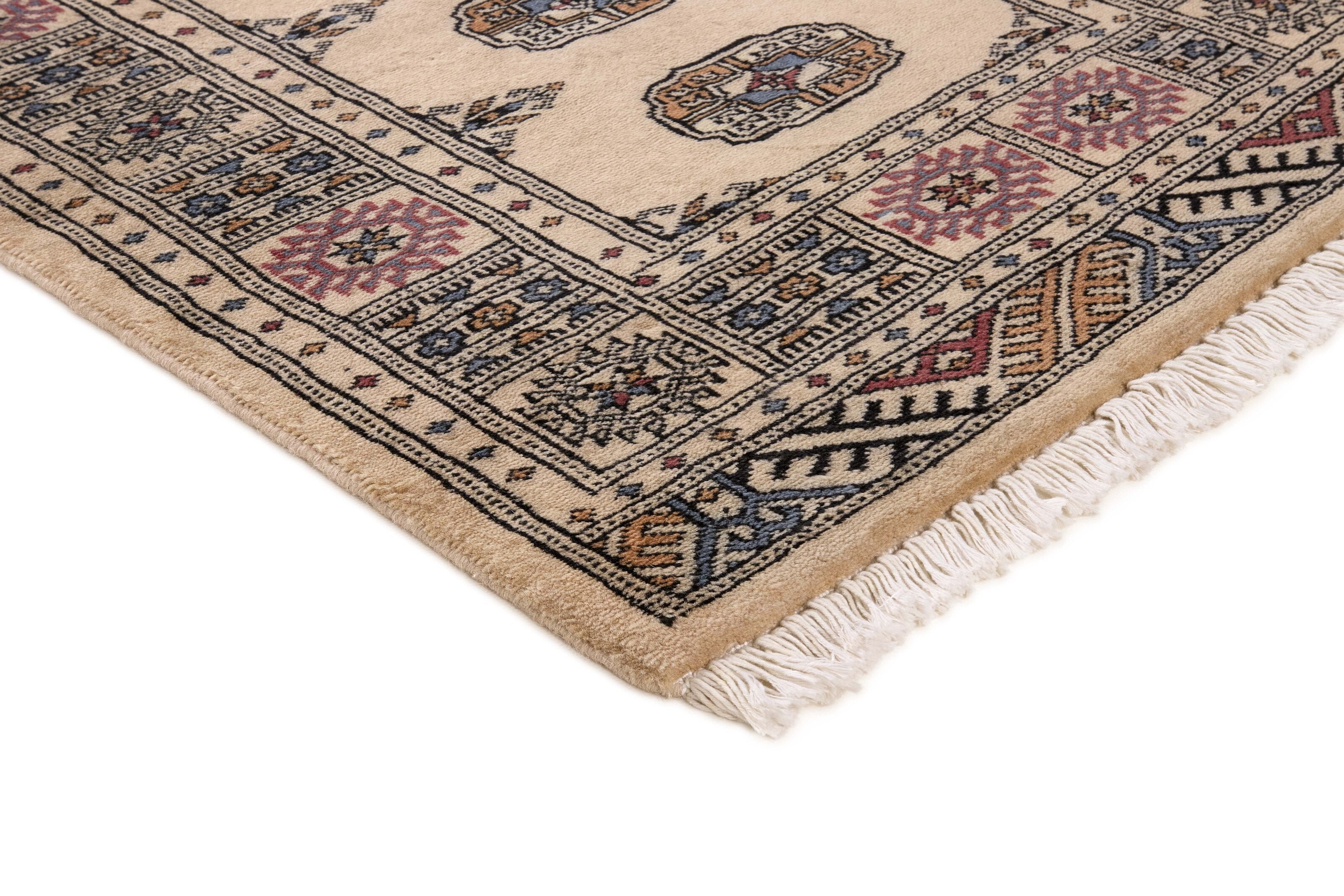 Beige Oriental rug with traditional bordered pattern