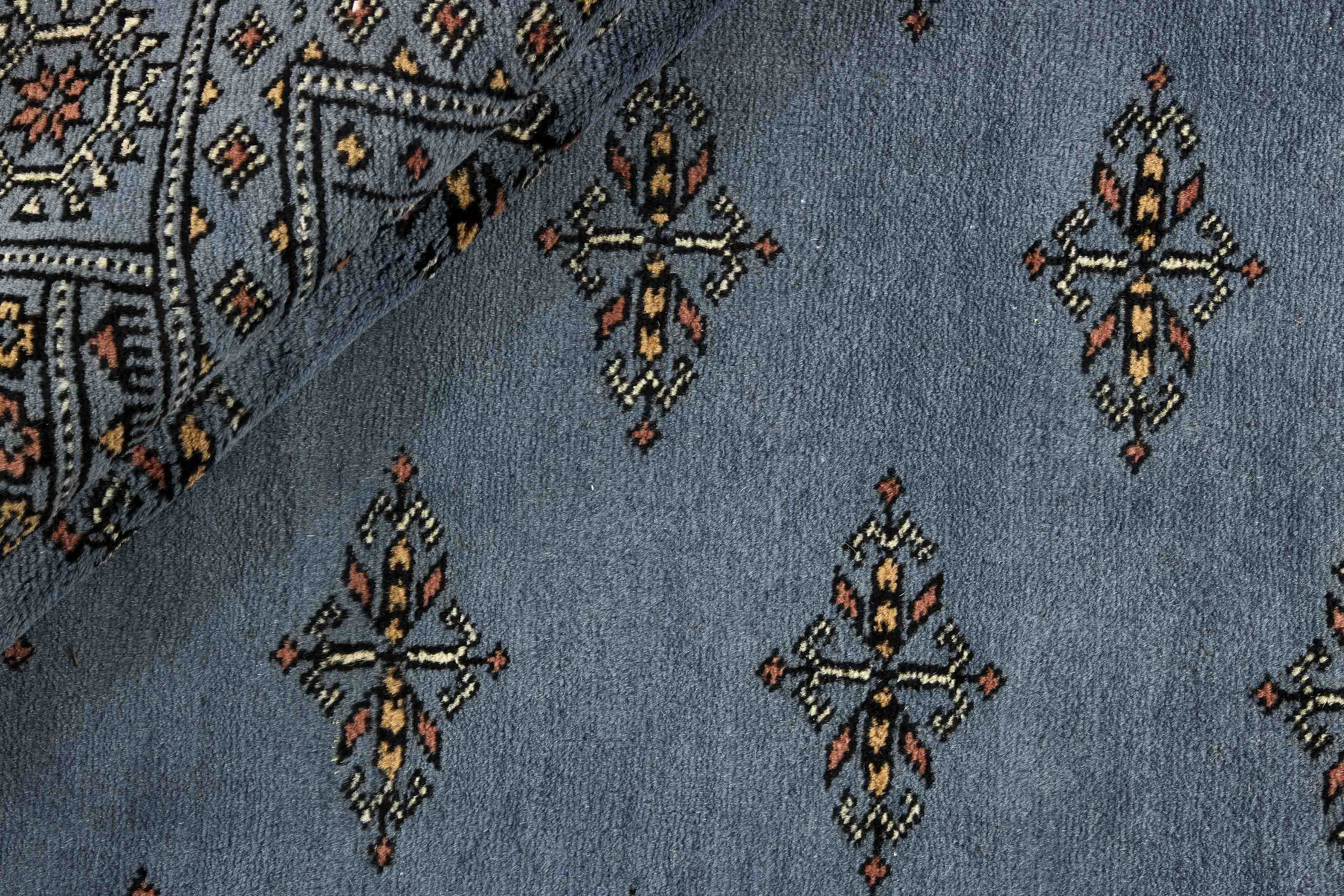 blue oriental rug with traditional pattern