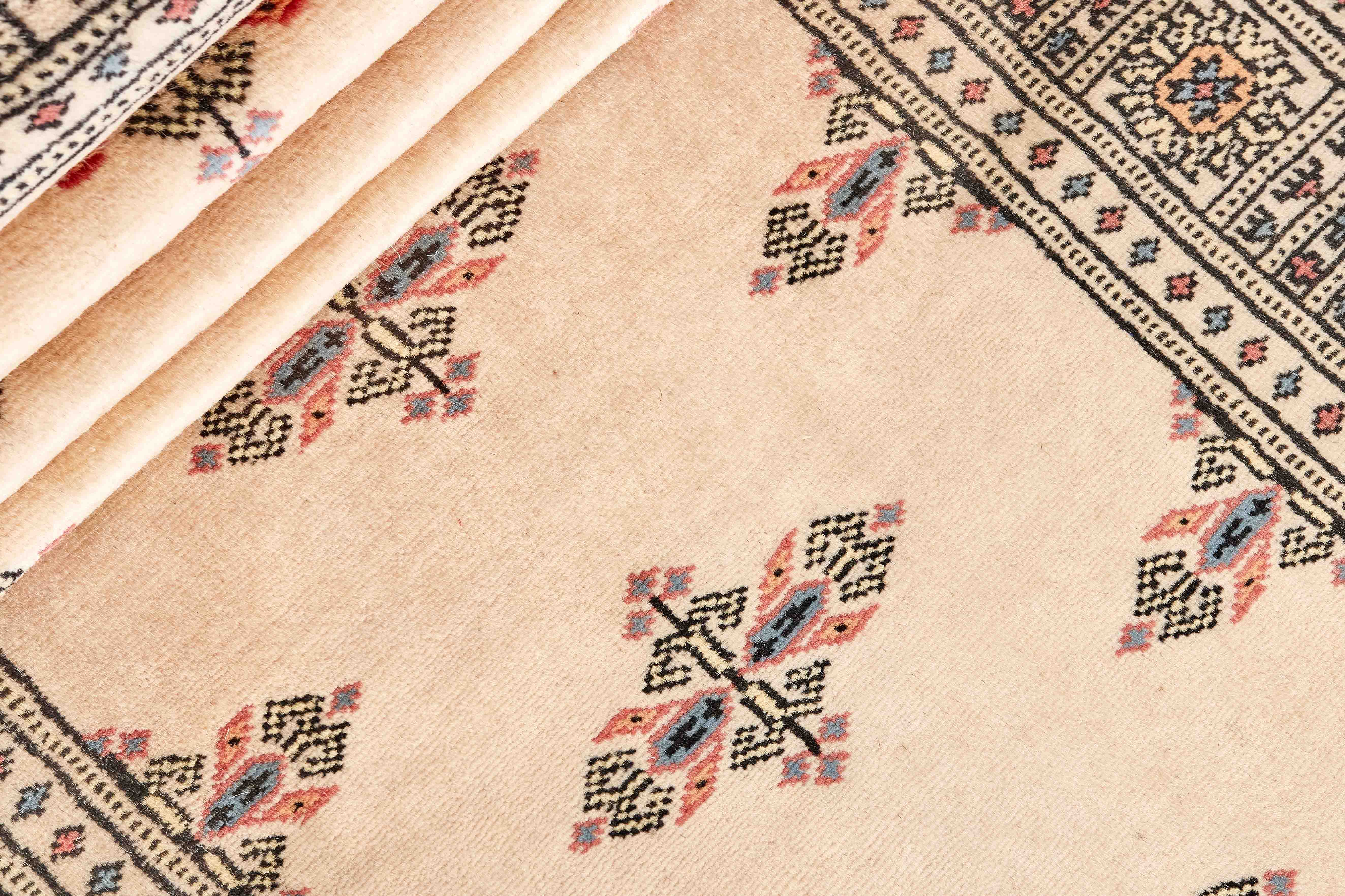 beige oriental runner with traditional gul pattern