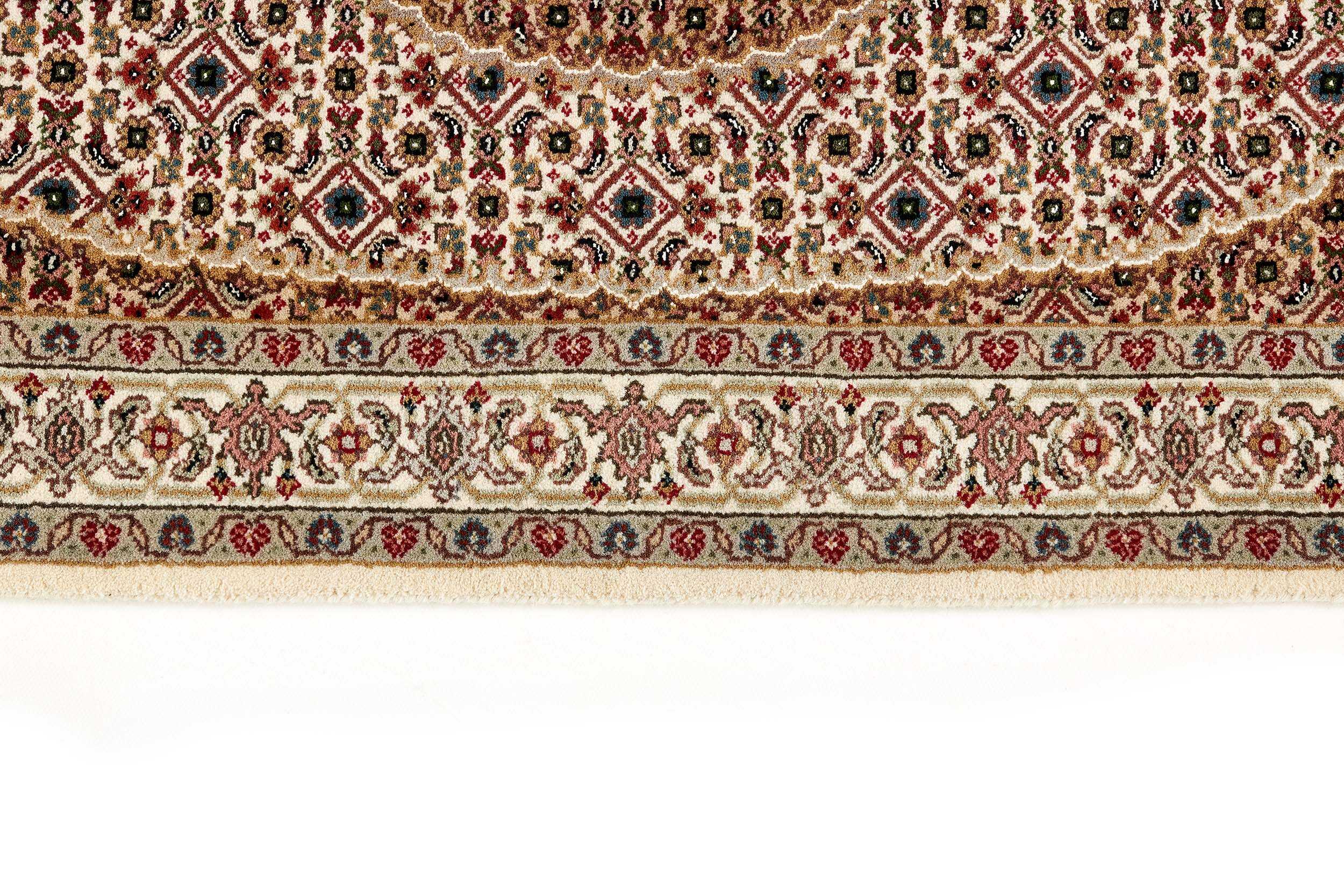 Authentic Oriental rug with traditional geometric and floral design in red