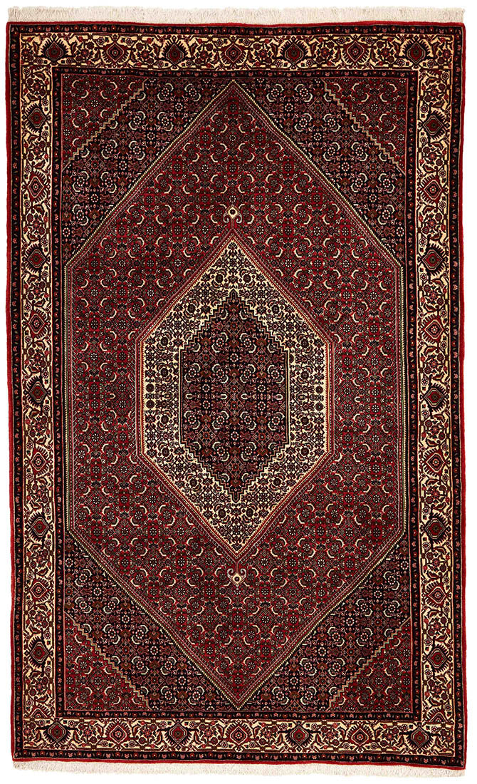 Red and cream persian rug with traditional floral design
