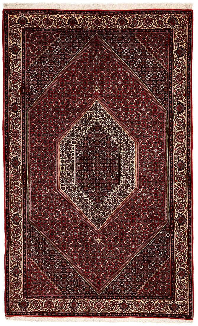 Red and cream persian rug with traditional floral design