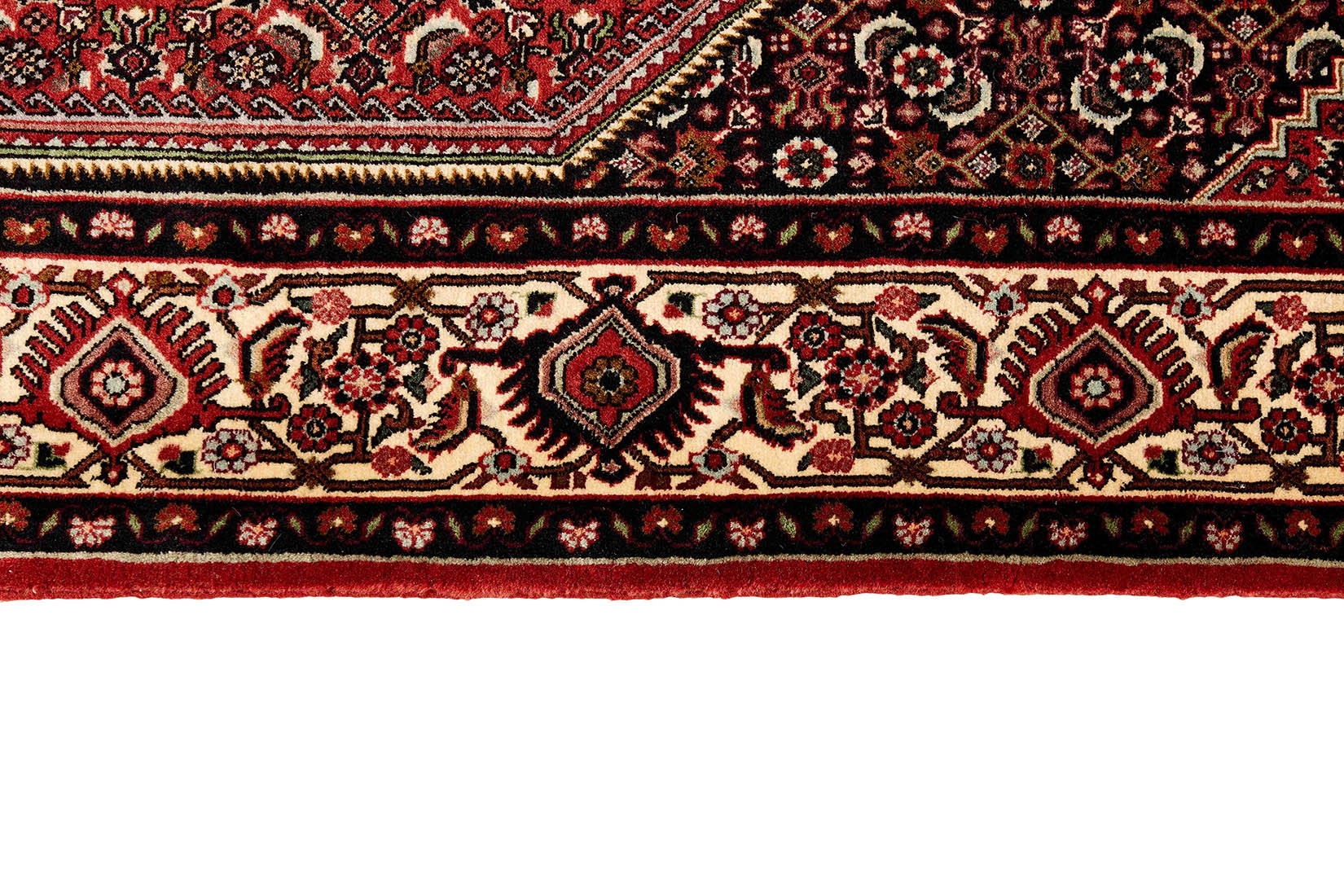Red and cream persian rug with traditional floral design