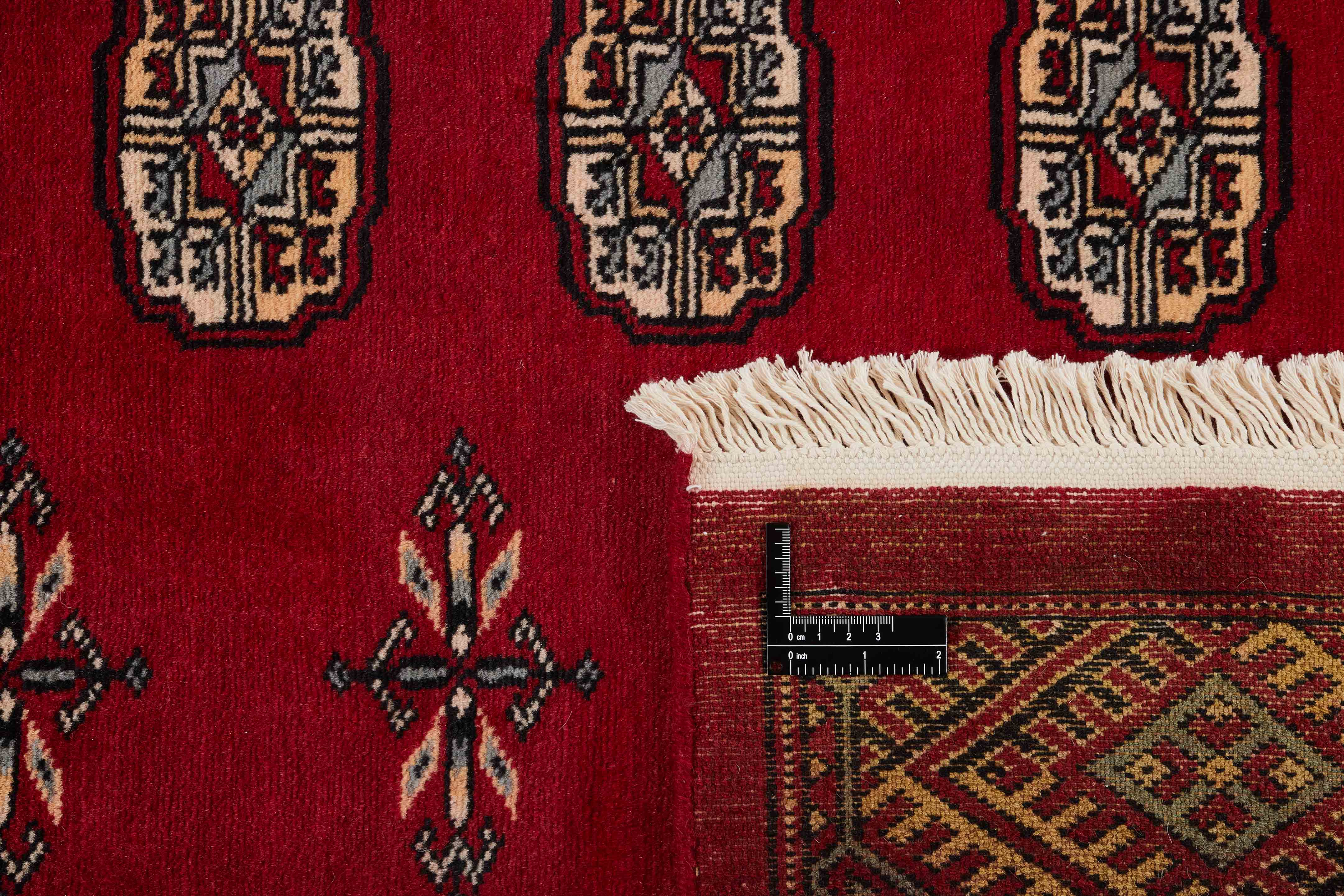 red oriental rug with traditional pattern
