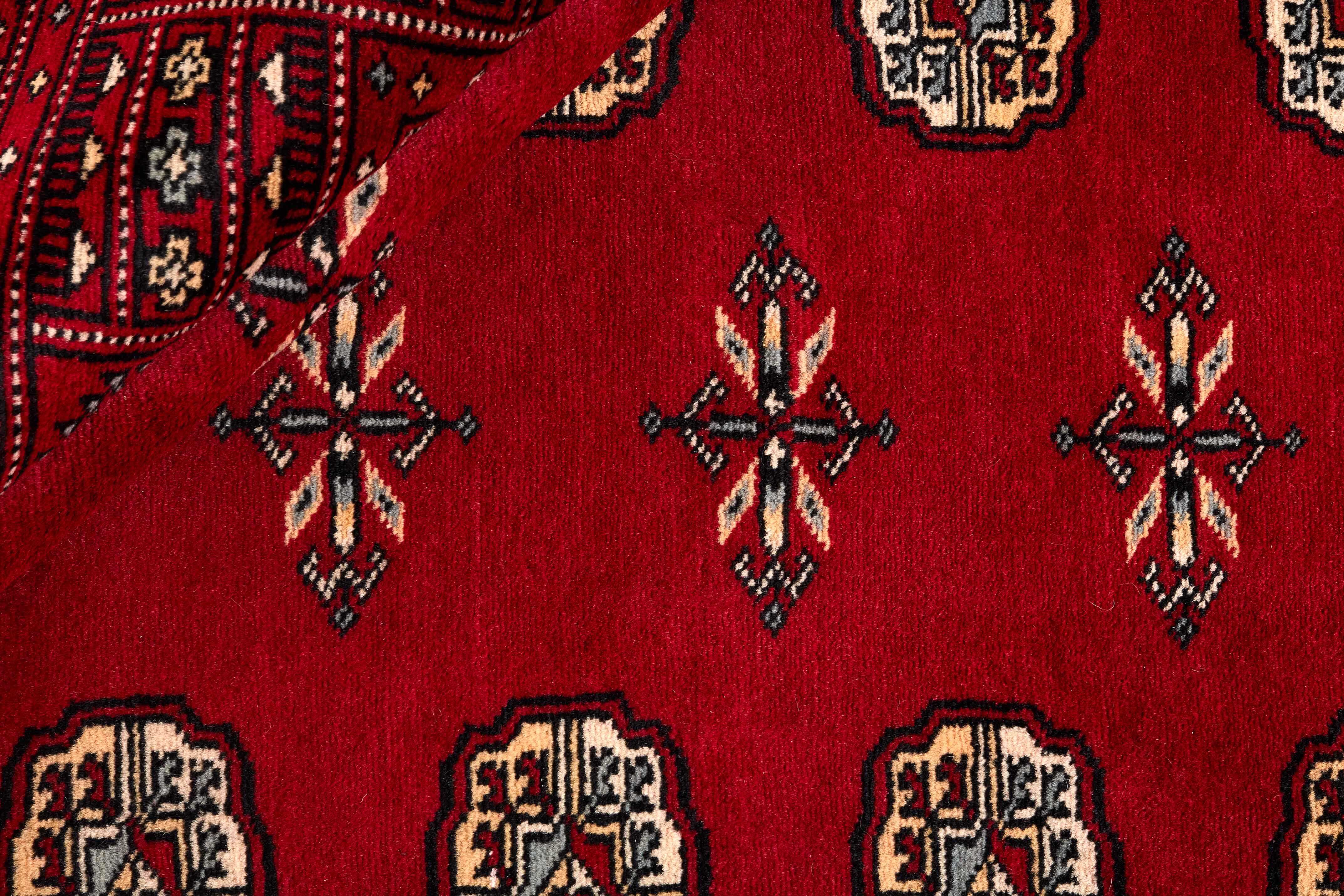red oriental rug with traditional pattern