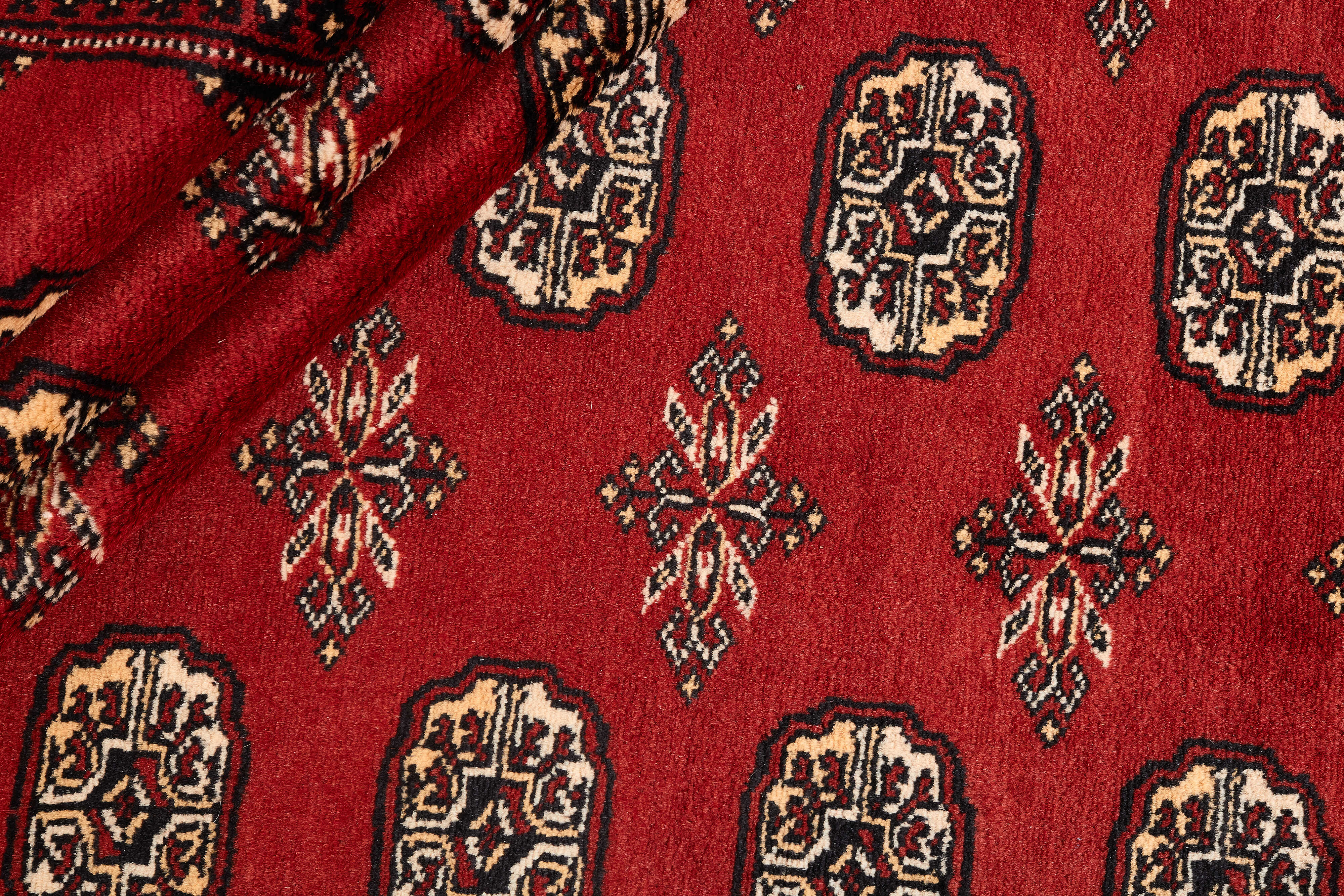 red oriental rug with traditional pattern