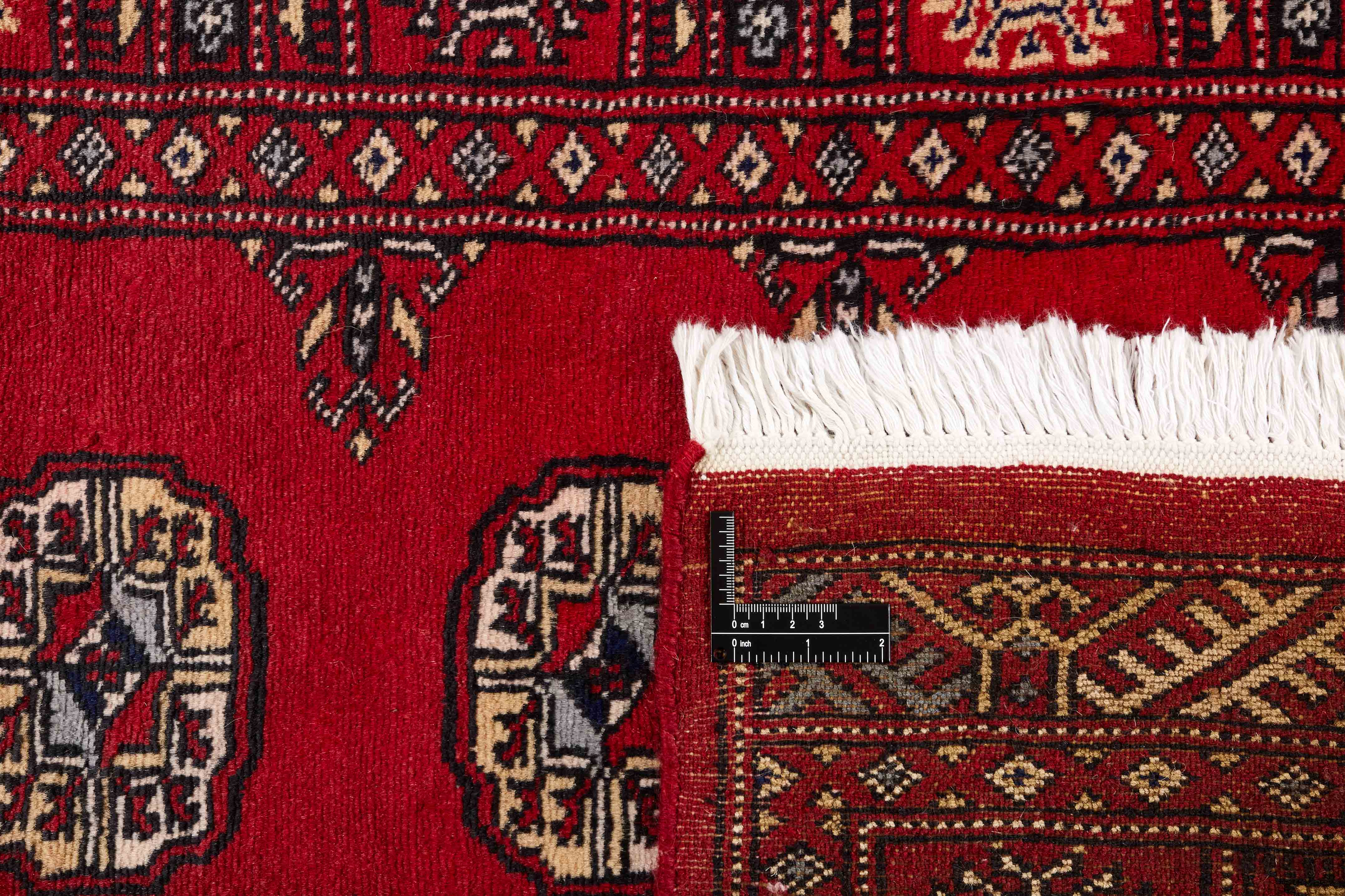 red oriental runner with traditional gul pattern
