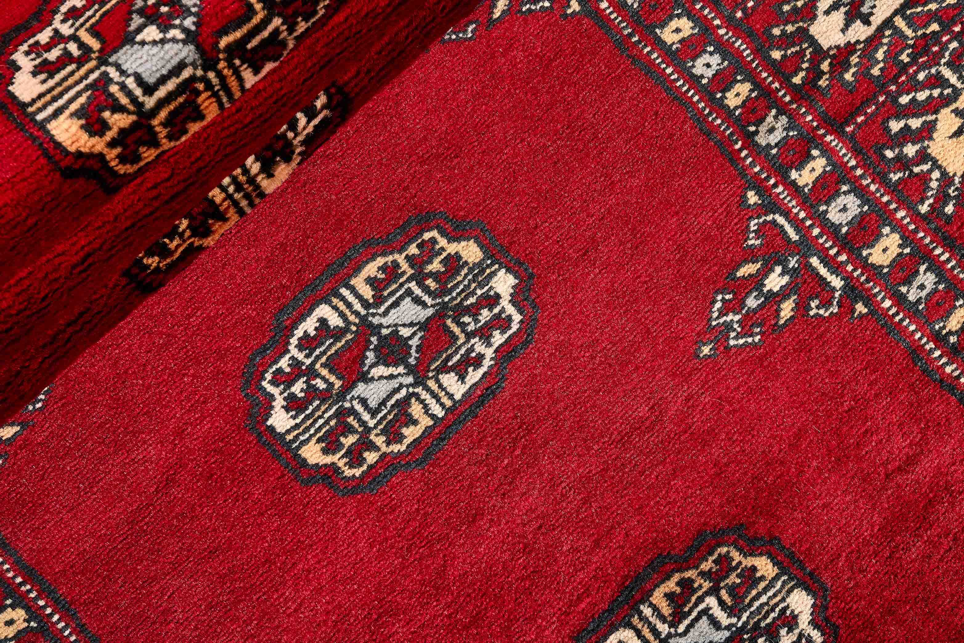 black oriental runner with traditional gul pattern