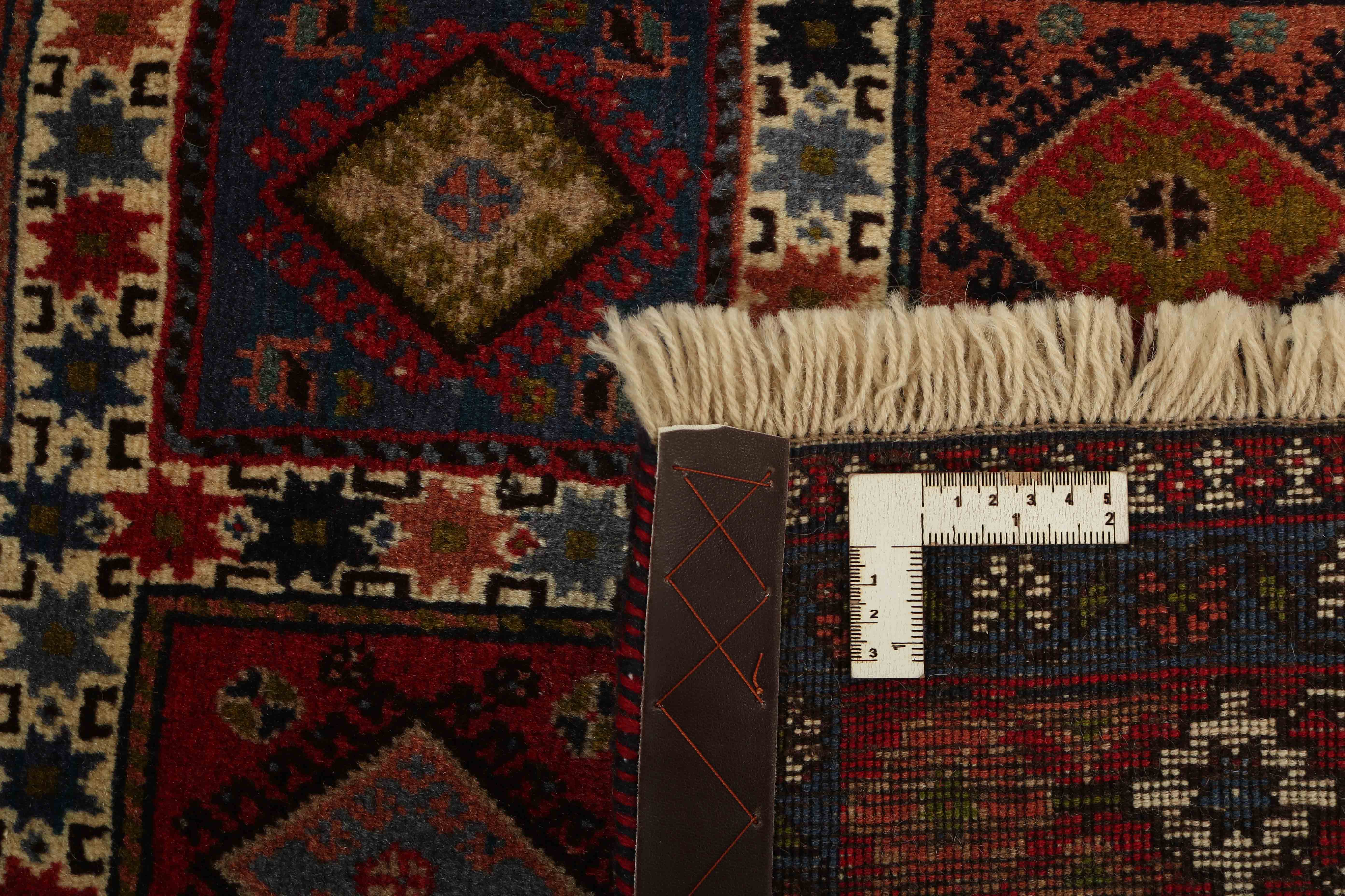 red authentic persian rug with a traditional design